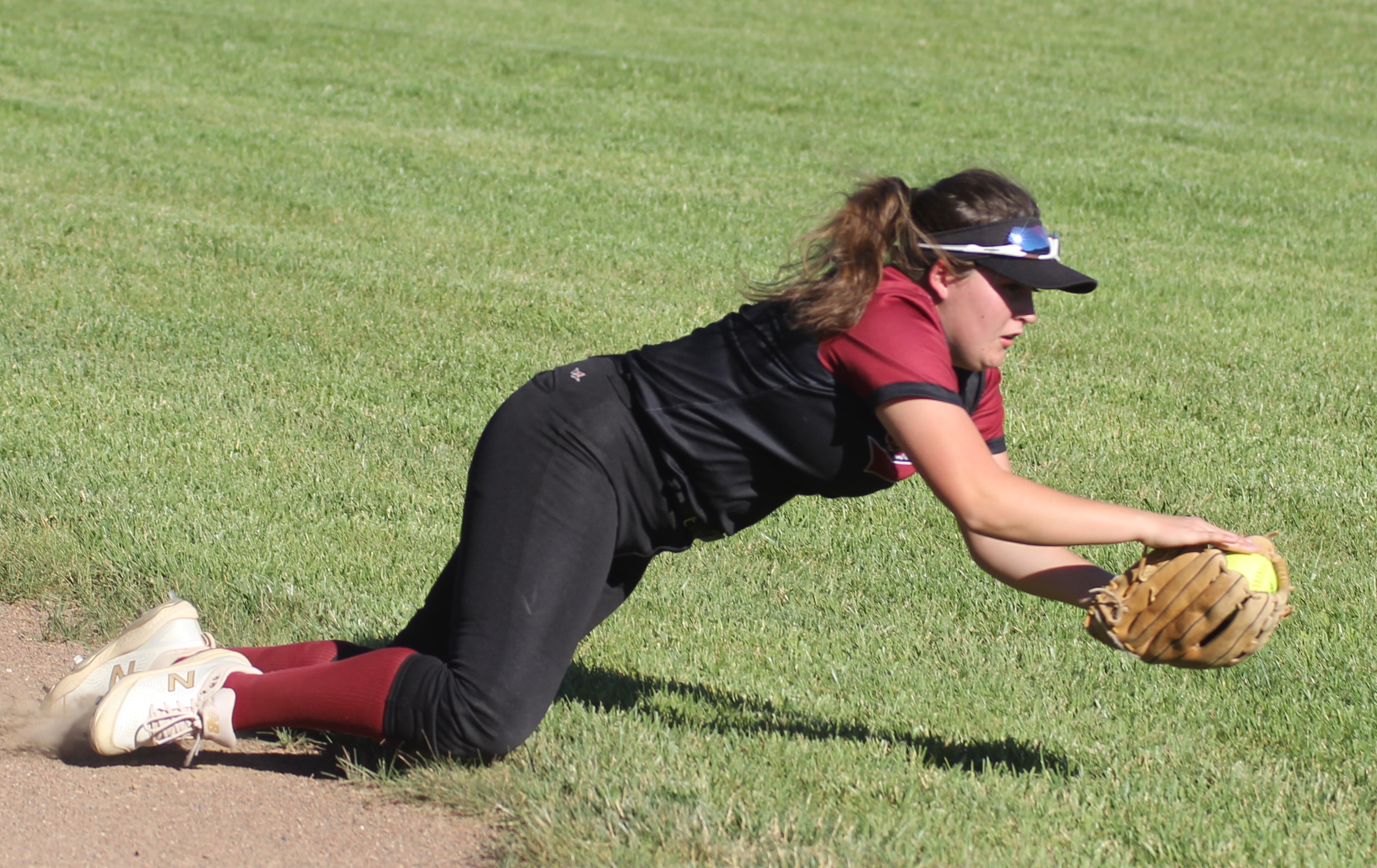 Clear Lake second baseman Grace Gomez lays out to catch a popup that saved a run and turned into an inning-ending double play in the top of the third inning.