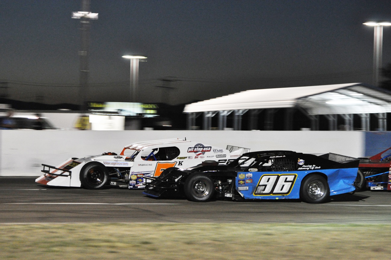 Kyle Tellstrom makes the winning pass of Keith Bloom (96) during a lap-55 restart Saturday night at the Shasta Speedway in Anderson. (Photos by Jennifer Belveal)