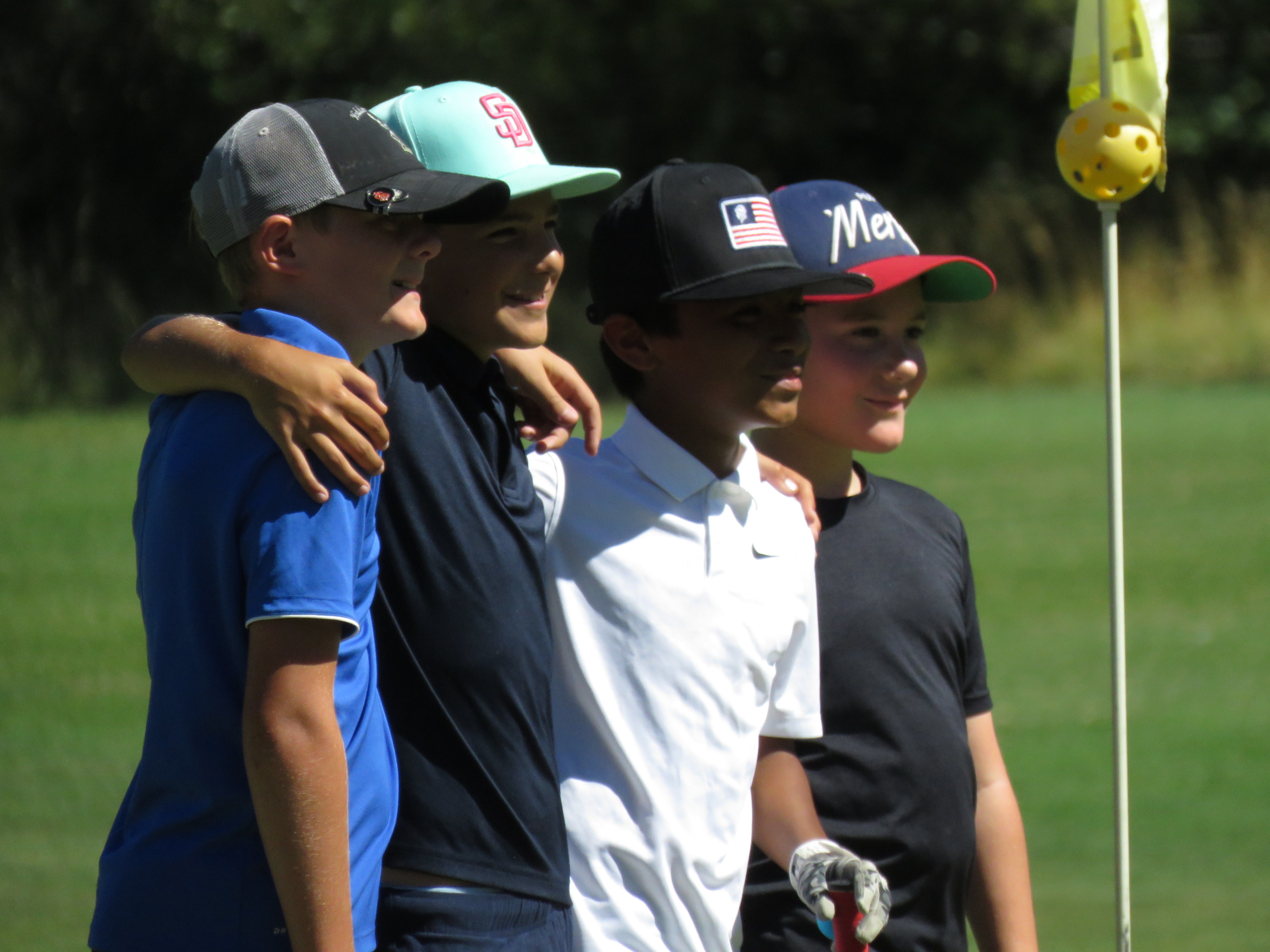The four participants in the boys age 10-11 flight pose for a photo following the conclusion of play. Hidden Valley Lake's Max Stine (second from left) took top honors.