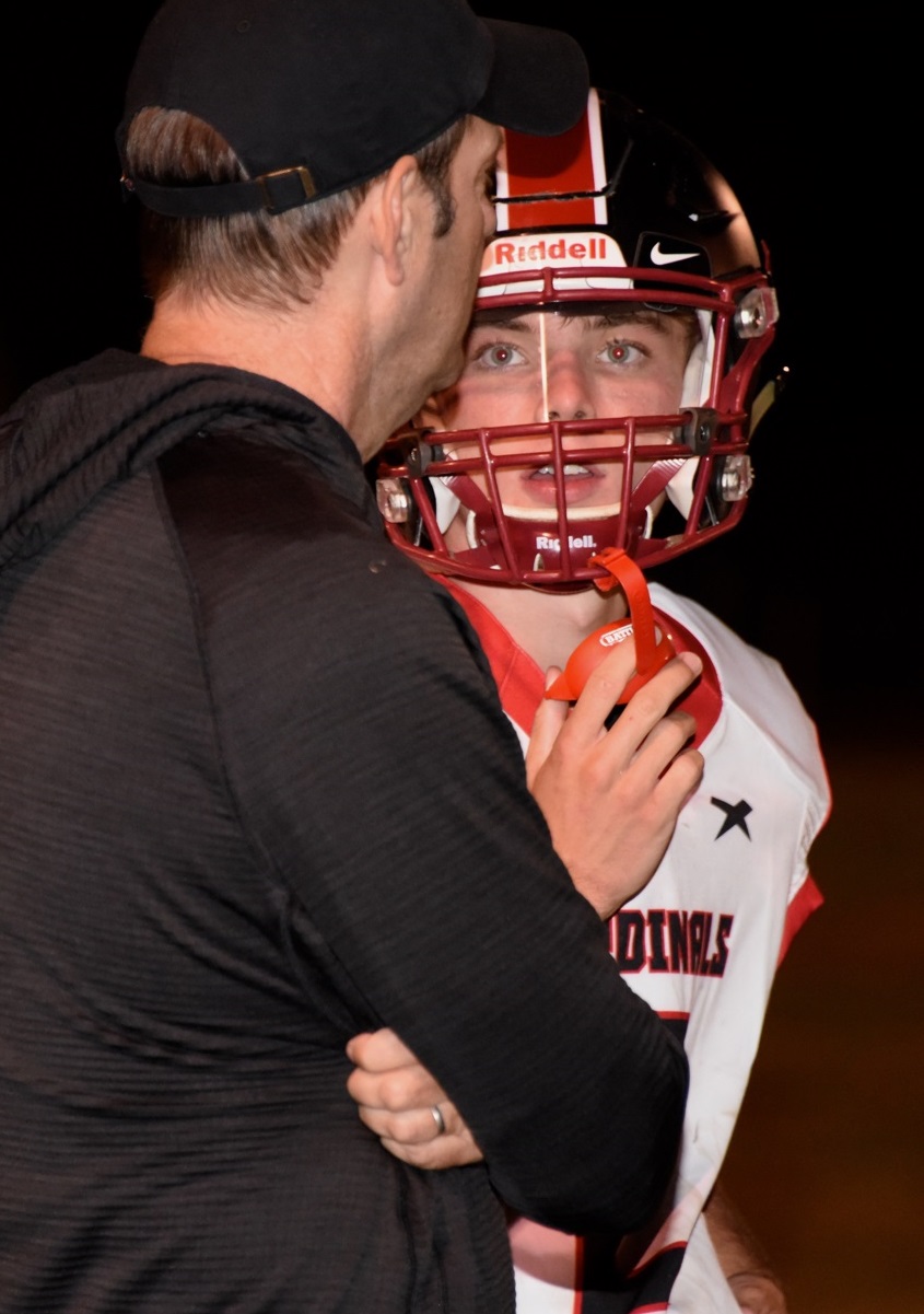 Clear Lake High School head coach Mark Cory talks things over with Jake Soderquist during a game last year. Soderquist moves into the starting quarterback position for the Cardinals as they embark on their 2022 season. (File photos)