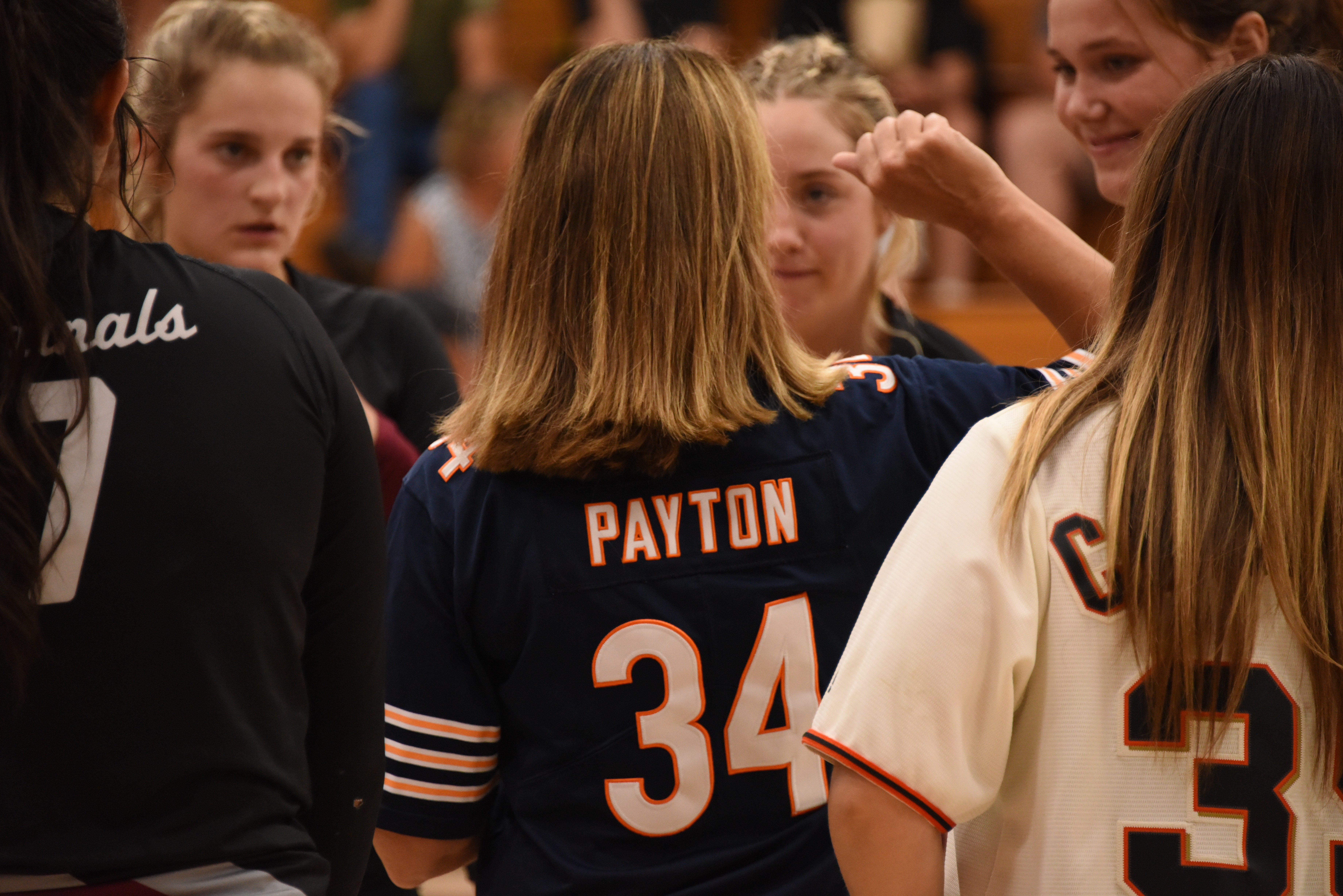 Clear Lake head coach Marci Psalmonds channels a little Walter Payton, the late NFL great, while huddling with players. (Photos courtesy of Trett Bishop)