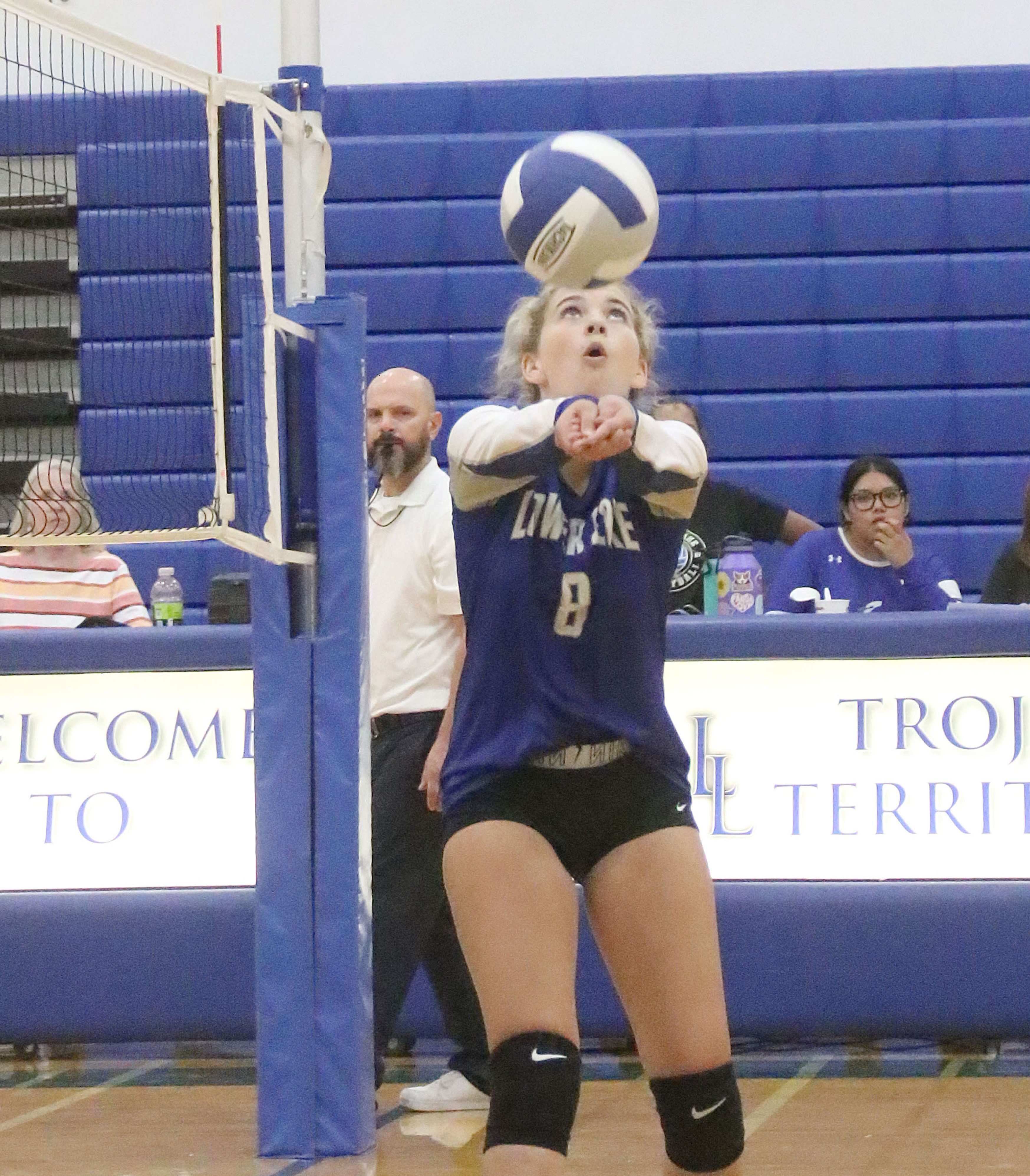 Lower Lake's Ayla Ales keeps her eye on the ball while setting up a teammate for a kill attempt against the Kelseyville Knights on Thursday in Lower Lake. (Photo by Minenna Photography)