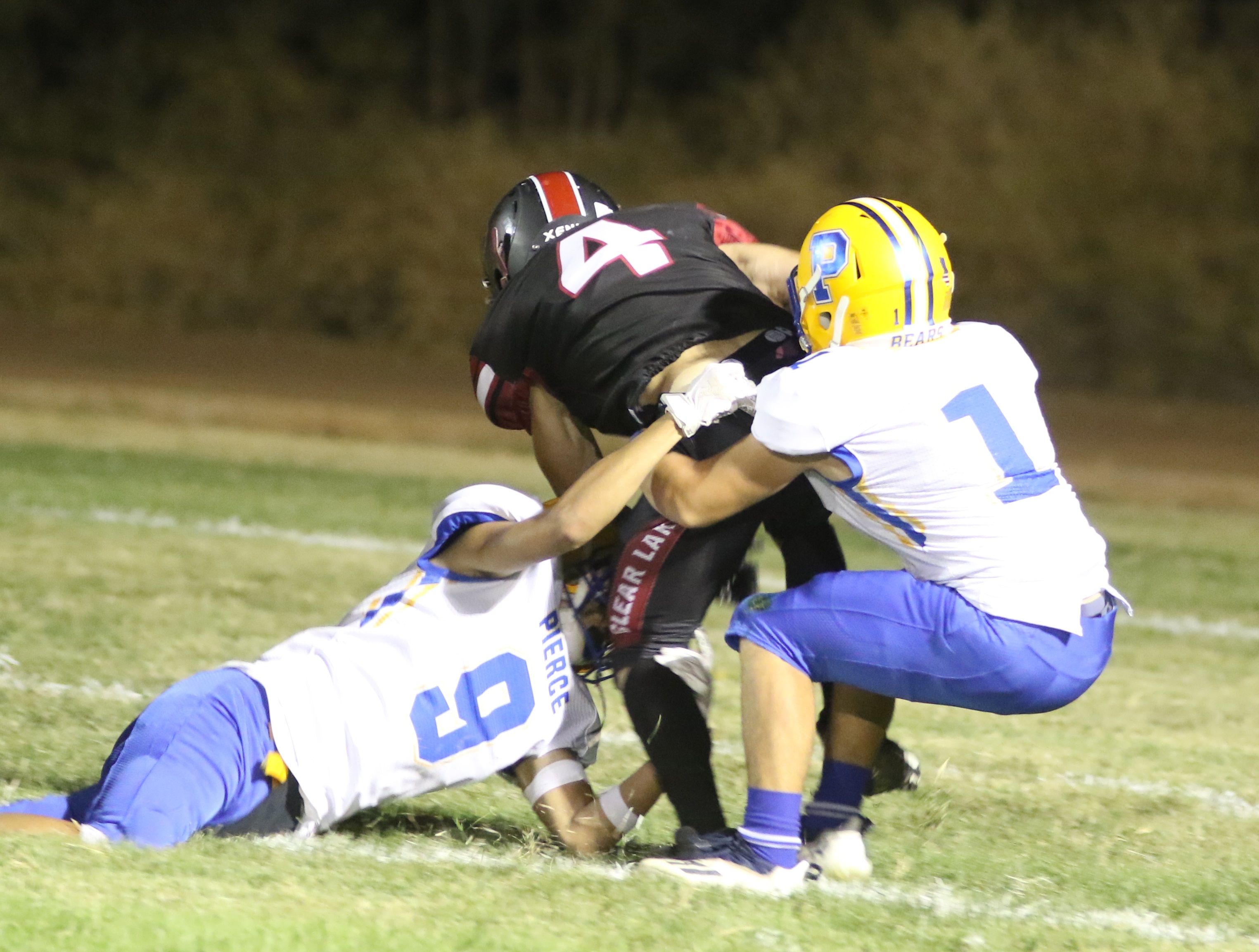 Clear Lake receiver Ayden Williamson is brought down after making a catch. He scored the go-ahead touchdown in the third quarter of the Cardinals' 28-15 win over Pierce on Friday night in Lakeport. (Photos by Minenna Photography)