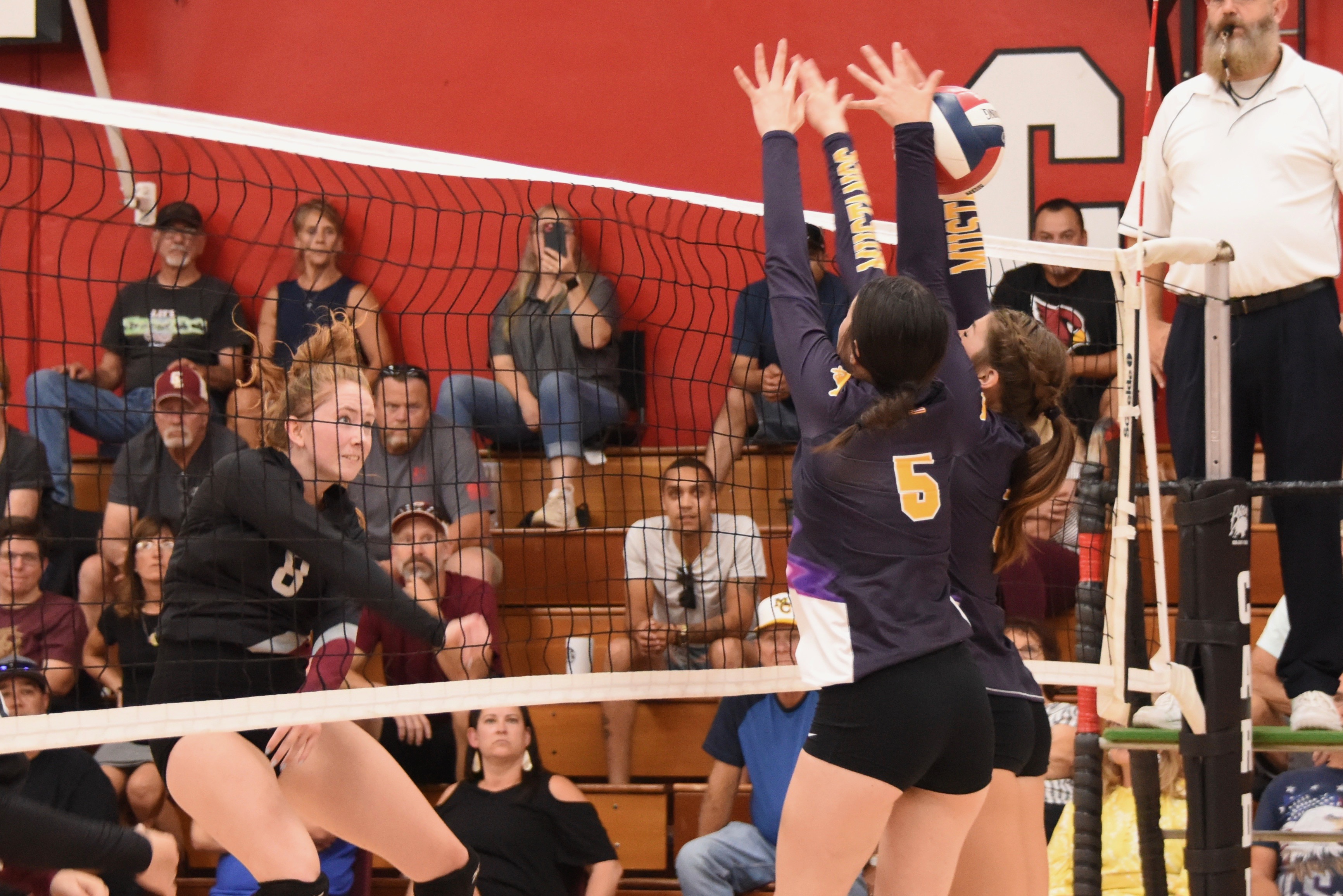 Clear Lake's Stella Hill hammers the ball as Middletown's Kamryn Atkins (5) and Mia Hoogendoorn go for the block. (Photos courtesy of Trett Bishop)
