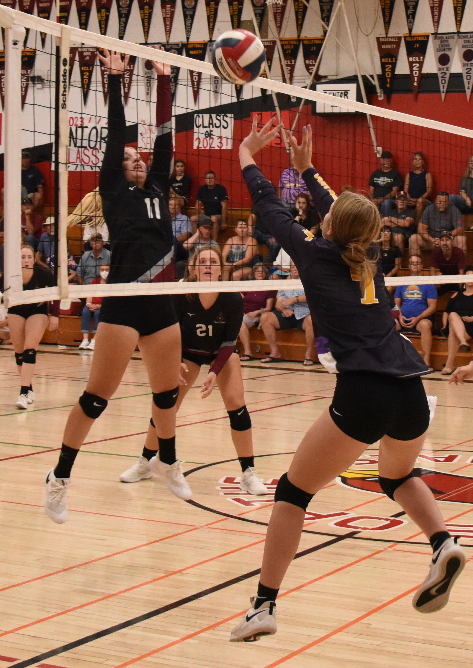 Clear Lake's Sierra Bruch plays defense as Middletown's Makayla Mace taps the ball over the net. (Photos courtesy of Trett Bishop)