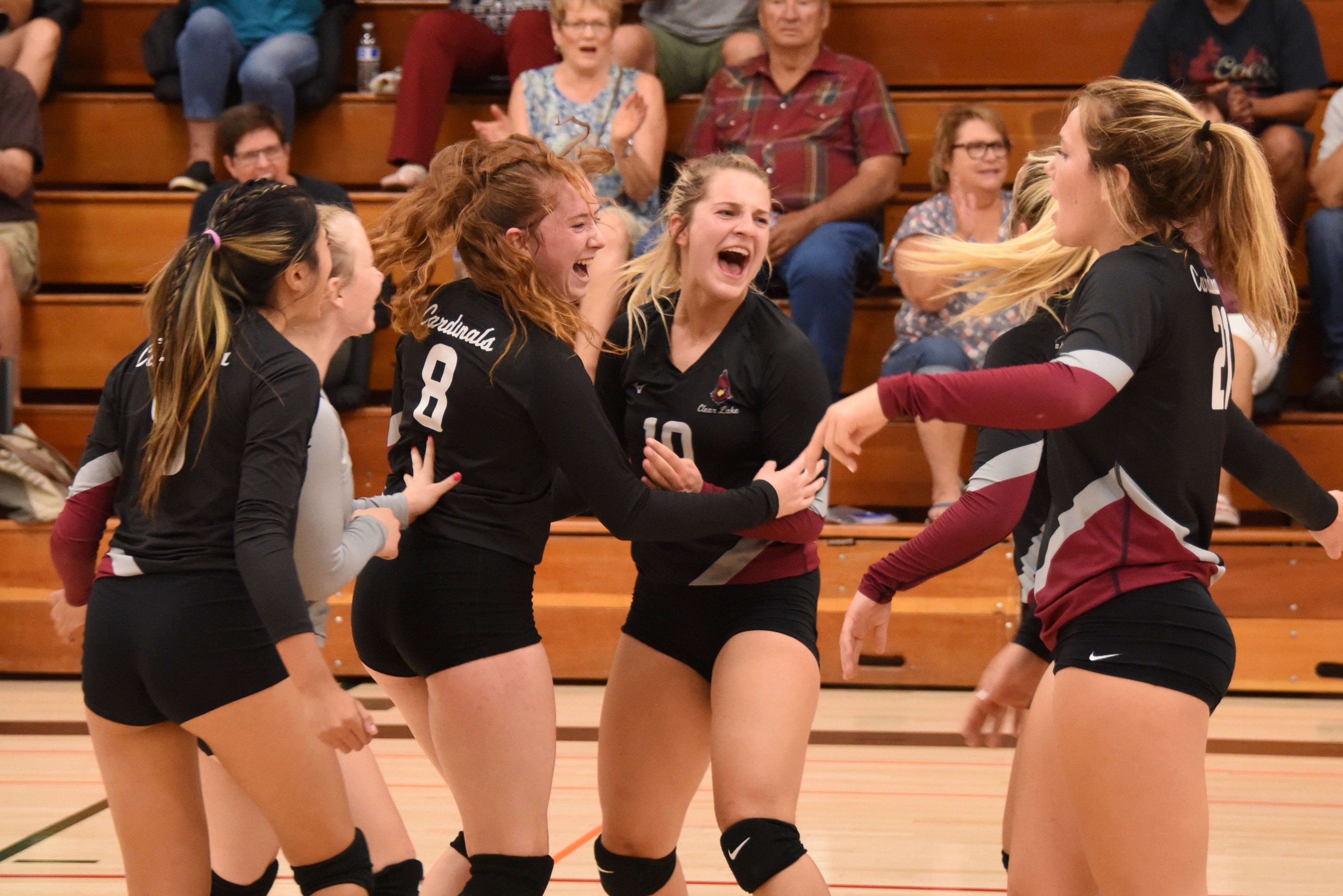 From left, Clear Lake's Rubi Ford, Amber Smart, Stella Hill, Quincy Paarsch, Abby Mertle and Sierra Bruch (behind Mertle) celebrate a Mertle kill. (Photos courtesy of Trett Bishop)