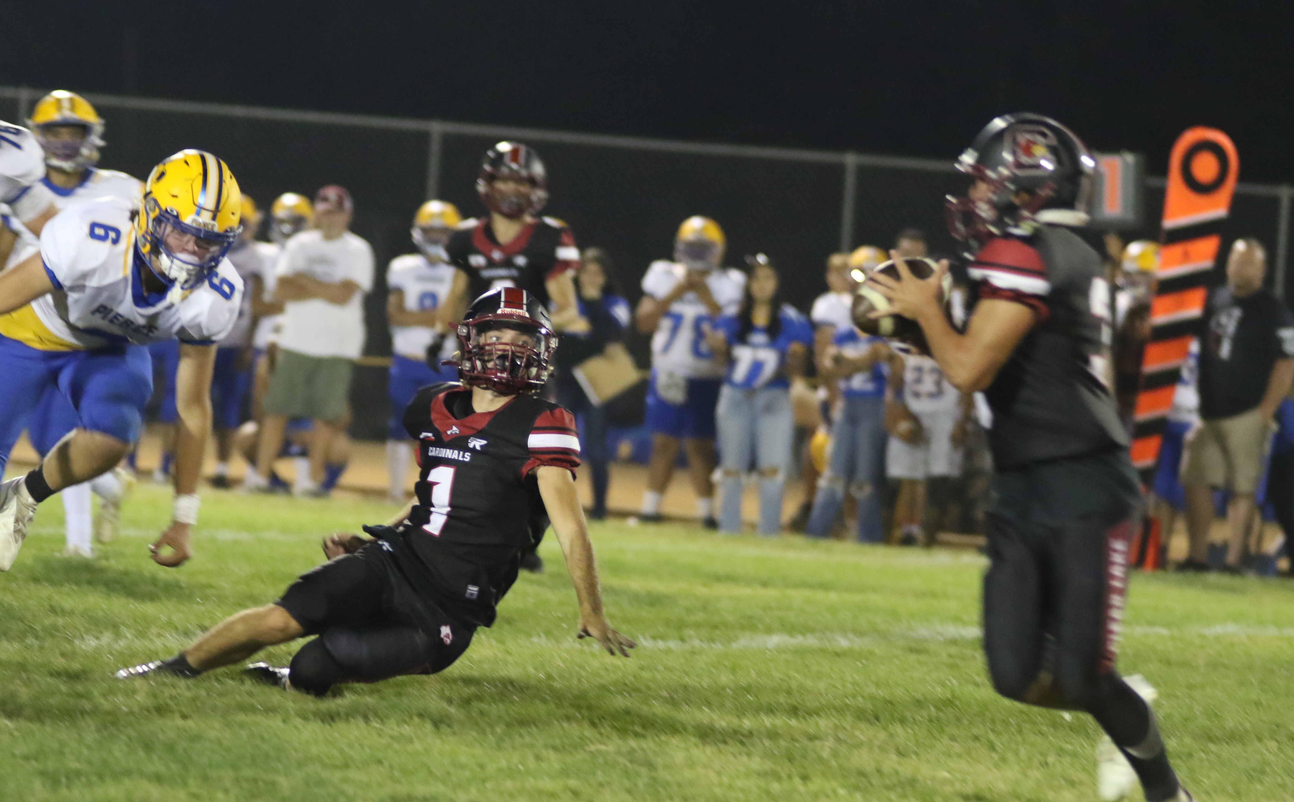 Clear Lake quarterback Jake Soderquist pitches the ball to running back Hank Ollenberger. (Photos by Minenna Photography)