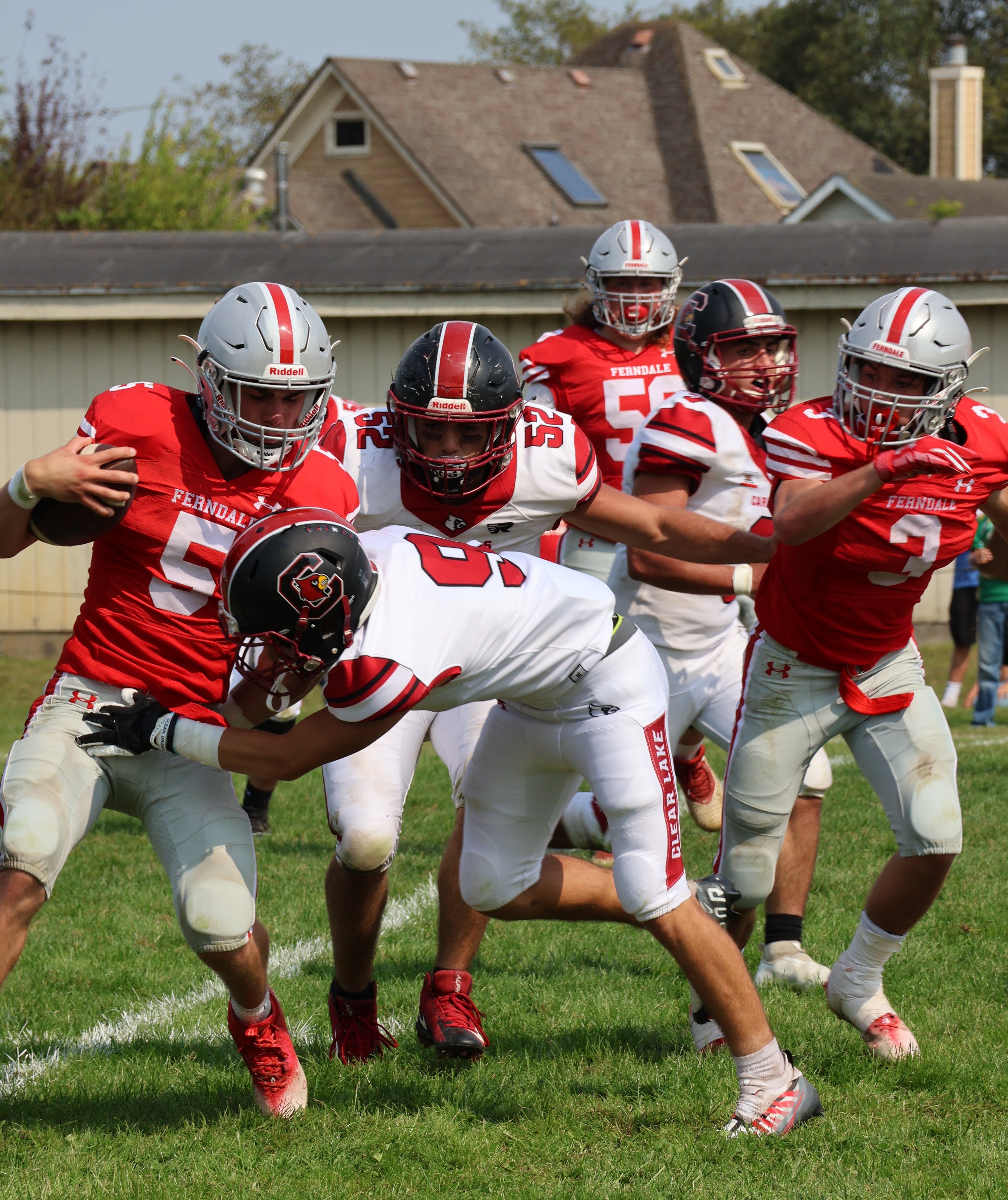 Clear Lake's Jesse Hayes (9) and Jonathan Decent bring down Ferndale's Jack Westfal. (Photos by Brian Sumpter)