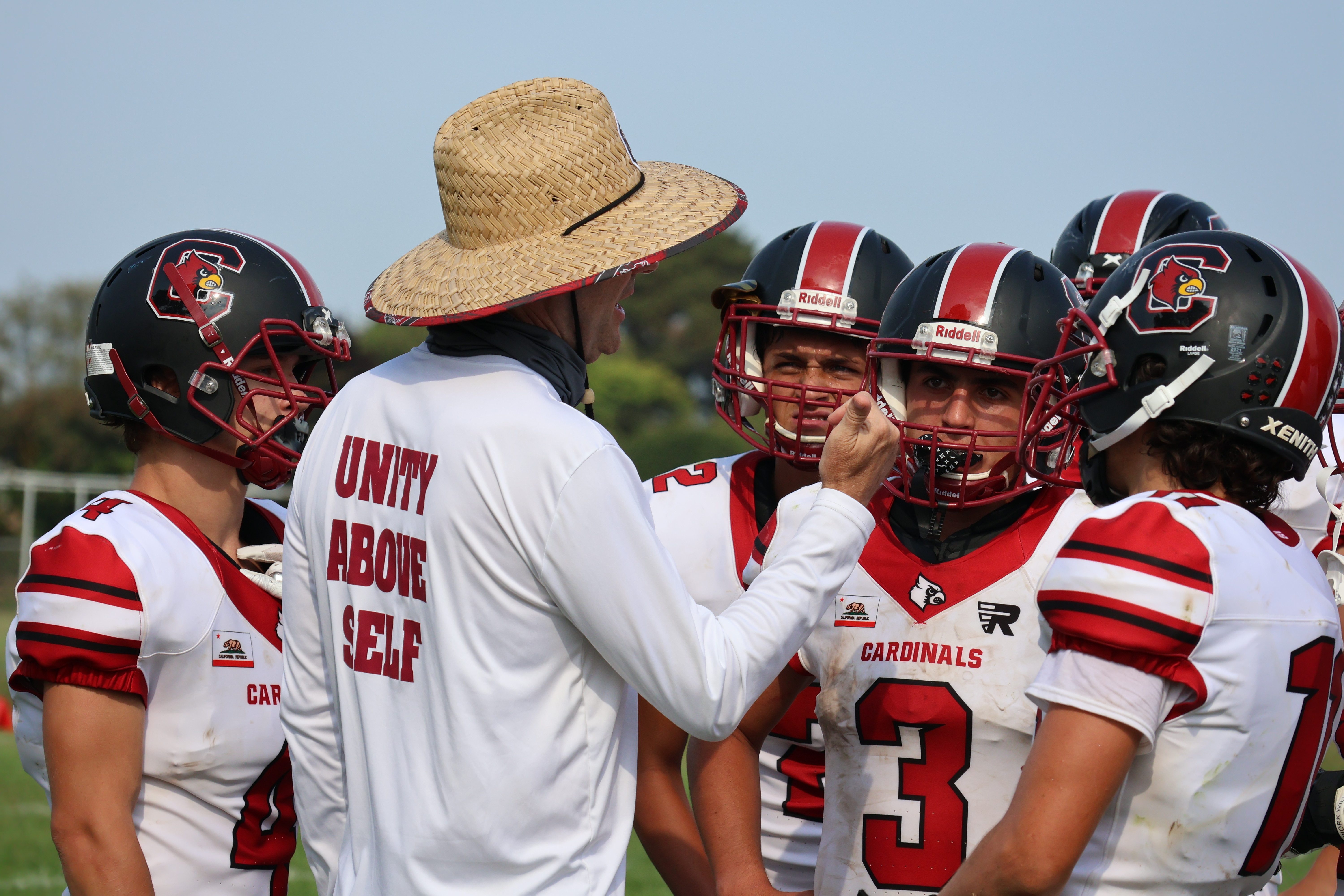 Clear Lake head coach Mark Cory huddles with his players during a timeout. (Photos by Brian Sumpter)
