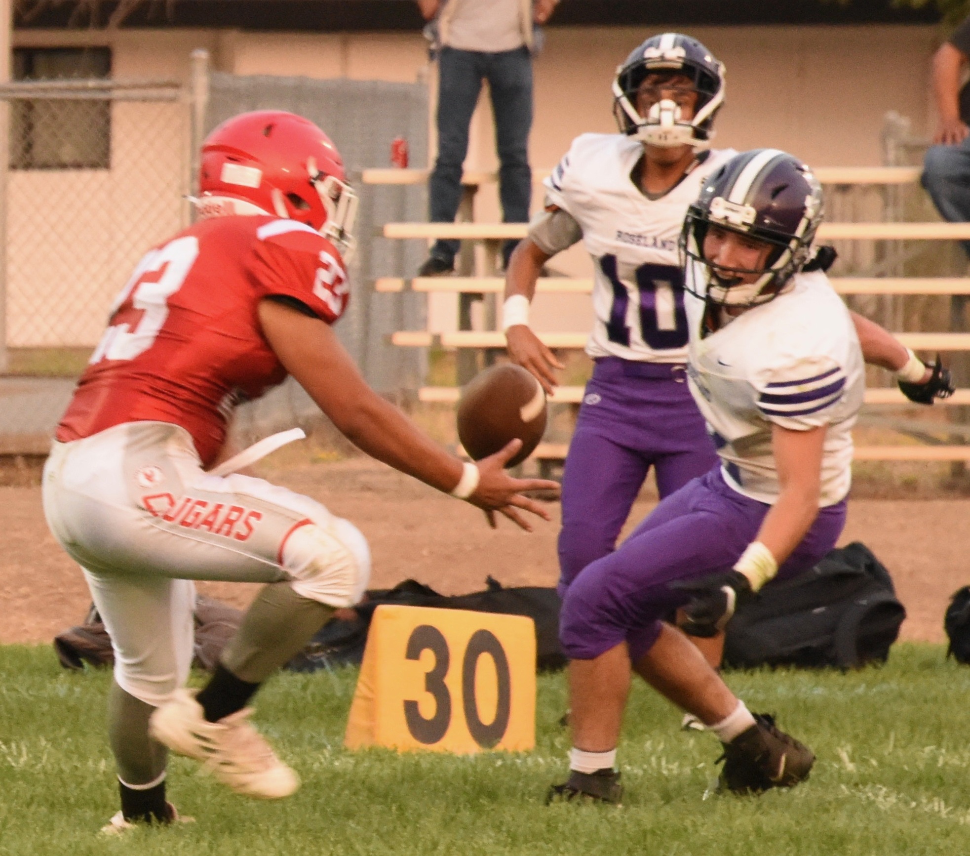 Upper Lake's Benjamin Beecher (left) intercepts a pass that was deflected by teammate Delaney Allison in the second quarter. (Photos courtesy of Trett Bishop)