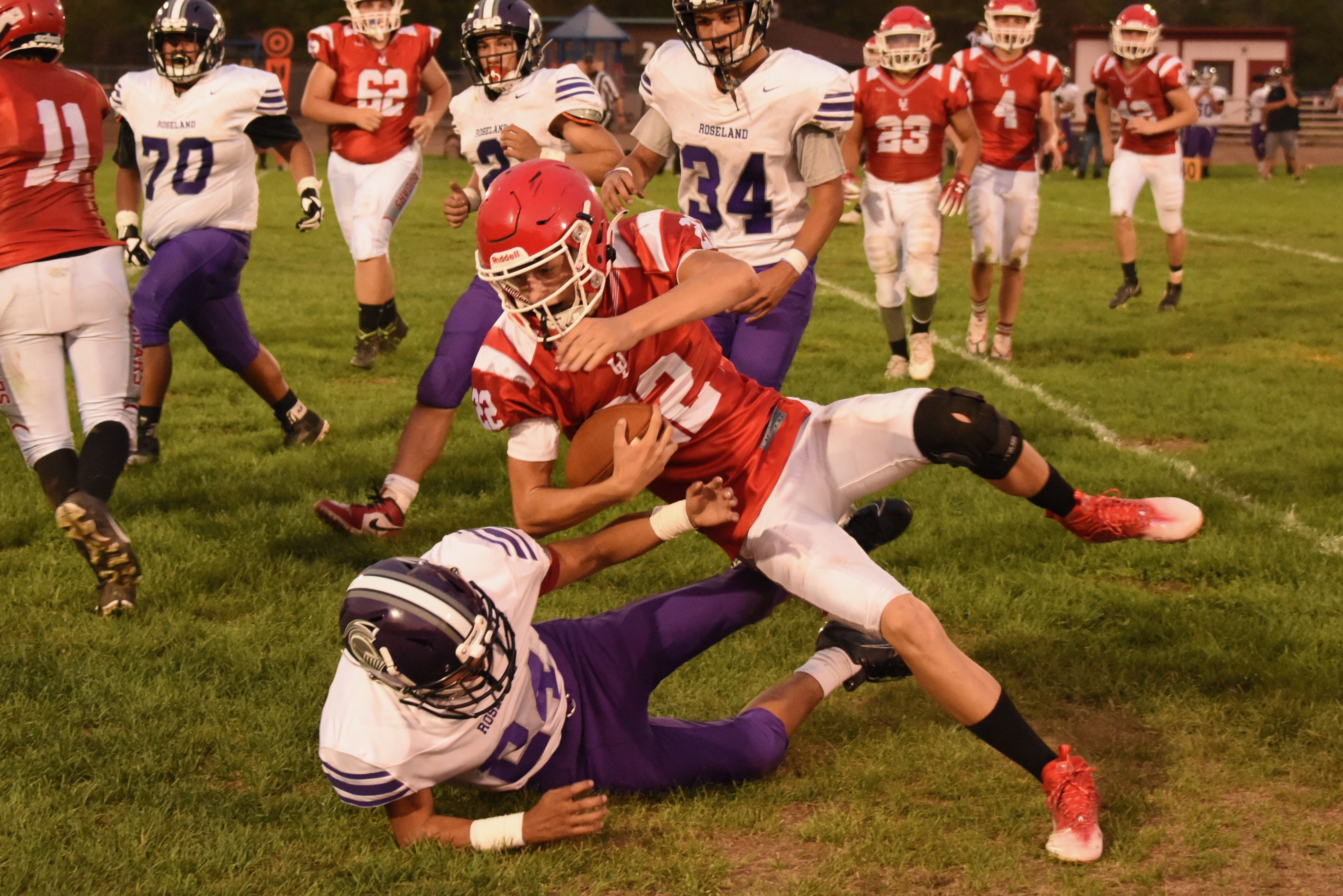 Upper Lake quarterback Jerod Rosales is knocked out of bounds after gaining a handful of yards along the sideline. (Photos courtesy of Trett Bishop)