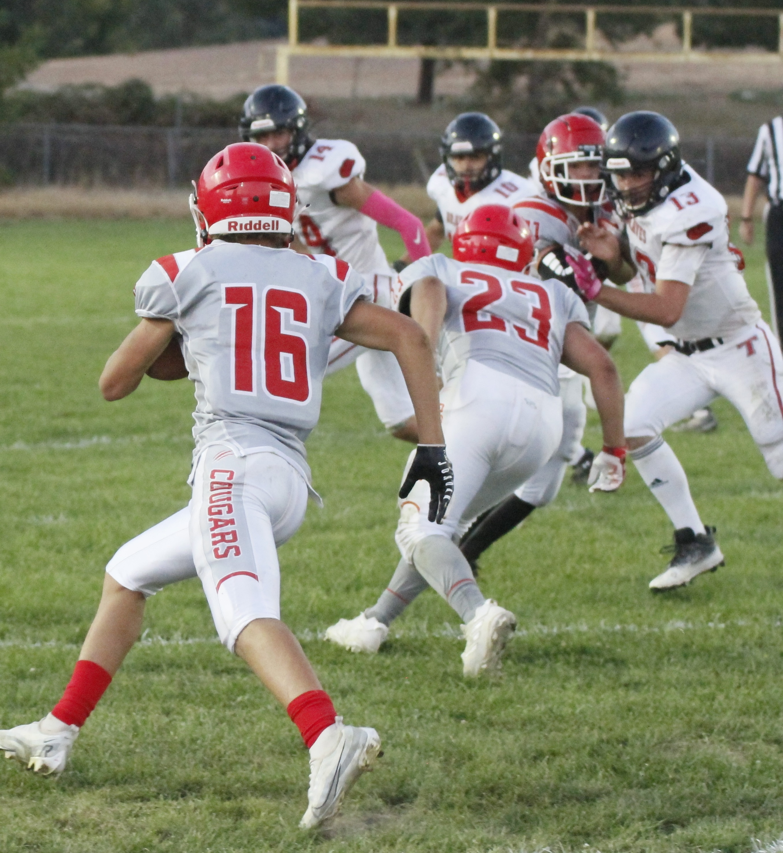 Upper Lake's Delaney Allison follows the lead block of Benjamin Beecher (23) on a running play Friday night against Tomales. Beecher rushed for 157 yards and Allison added another 40 in Upper Lake's 24-6 win at Upper Lake. (Photos by Minenna Photography)