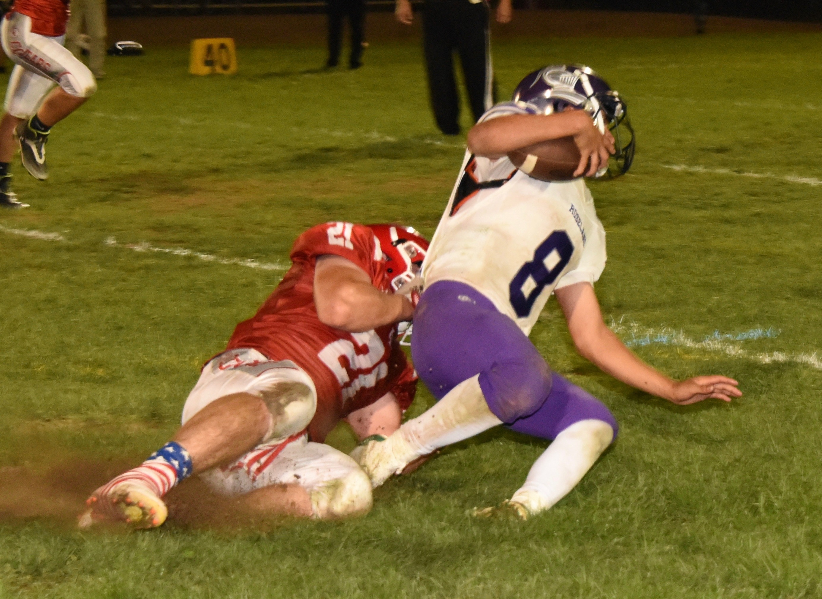 Upper Lake's Will Henry drops Roseland University Prep quarterback Isaiah Velazquez for a loss on a fourth-and-two play in the third quarter. Upper Lake scored two plays later to take a 52-16 lead. (Photos courtesy of Trett Bishop)