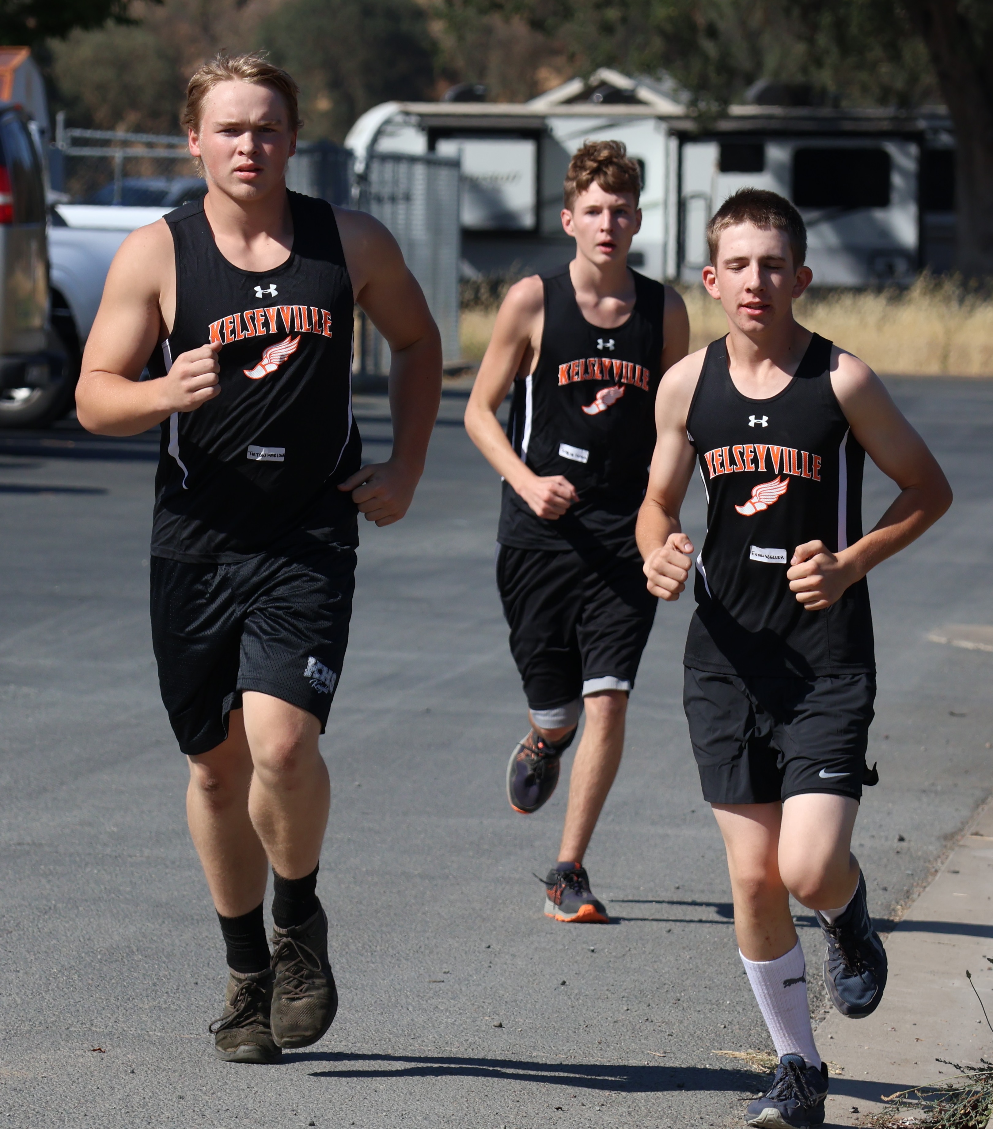 From left, Kelseyville's Triton Marlowe, Joshua Fossa and Evan Weller make their way along the 3.1-mile Kelseyville course on Wednesday afternoon. (Photos by Brian Sumpter)