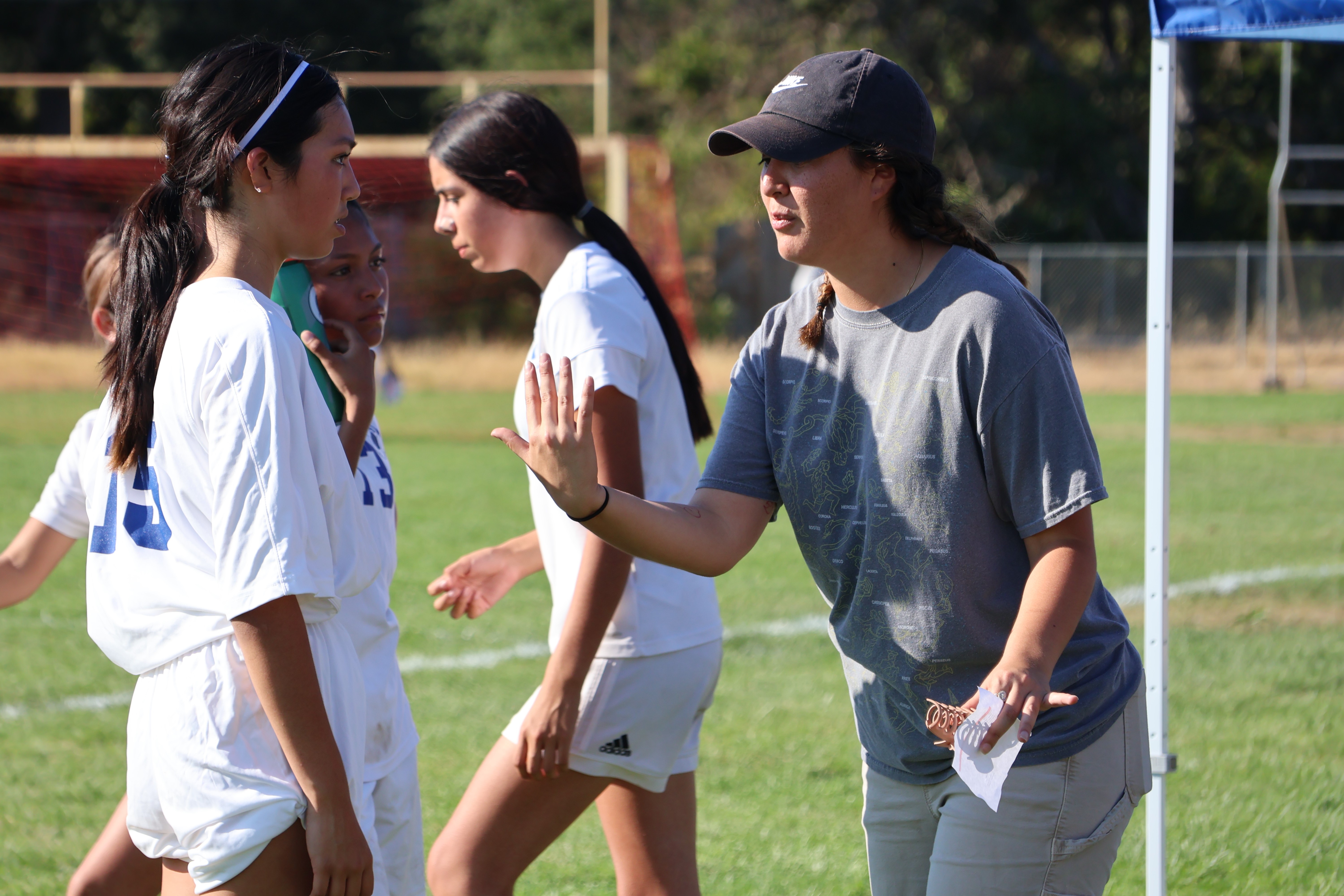 Lower Lake head coach Ana Duran talks things over with Cesna Zuniga during halftime. (Photos by Brian Sumpter)