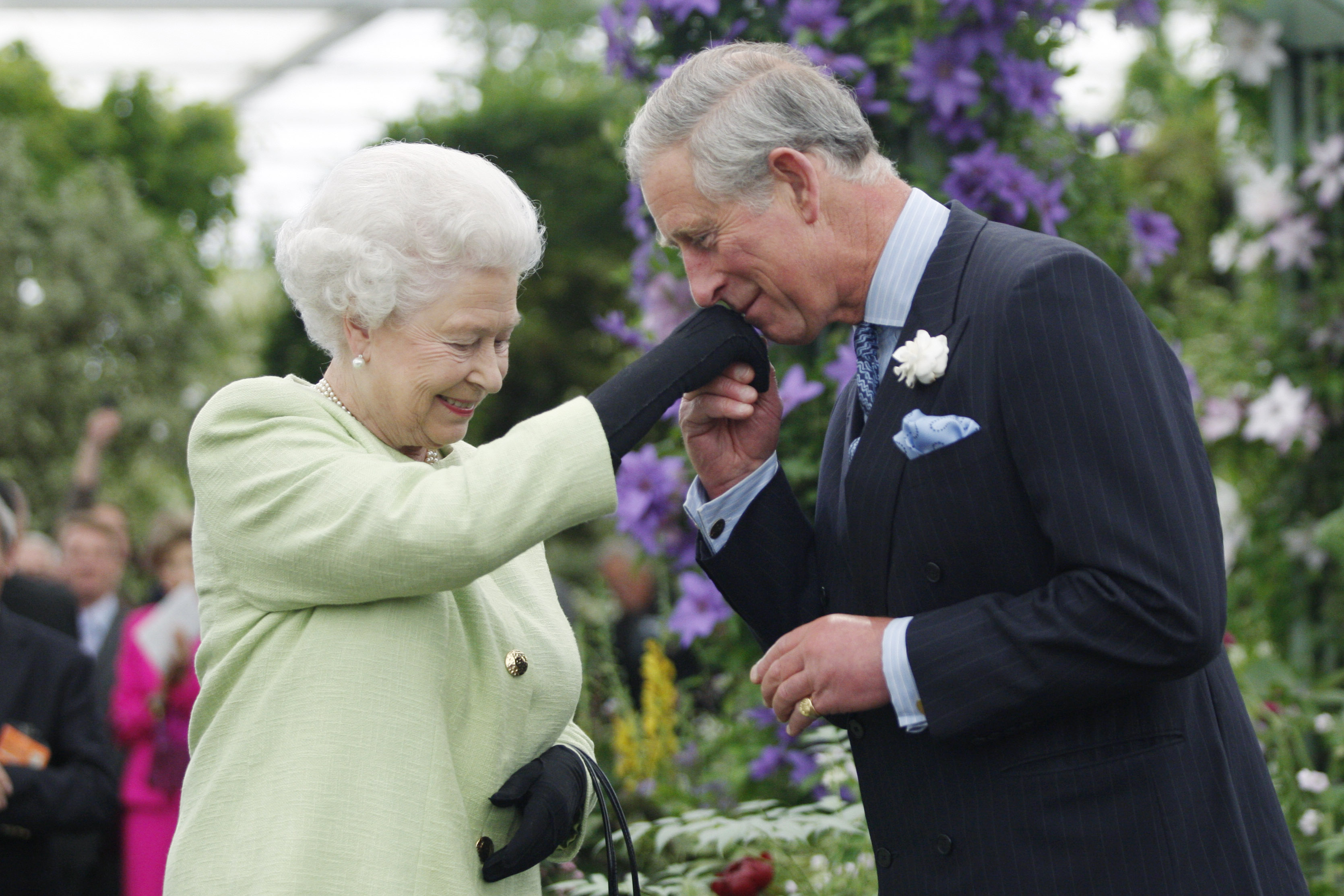 Queen Elizabeth II presents Prince Charles, Prince of Wales with the Royal Horticultural Society's Victoria Medal of Honour during a visit to the Chelsea Flower Show on May 18, 2009 in London.
