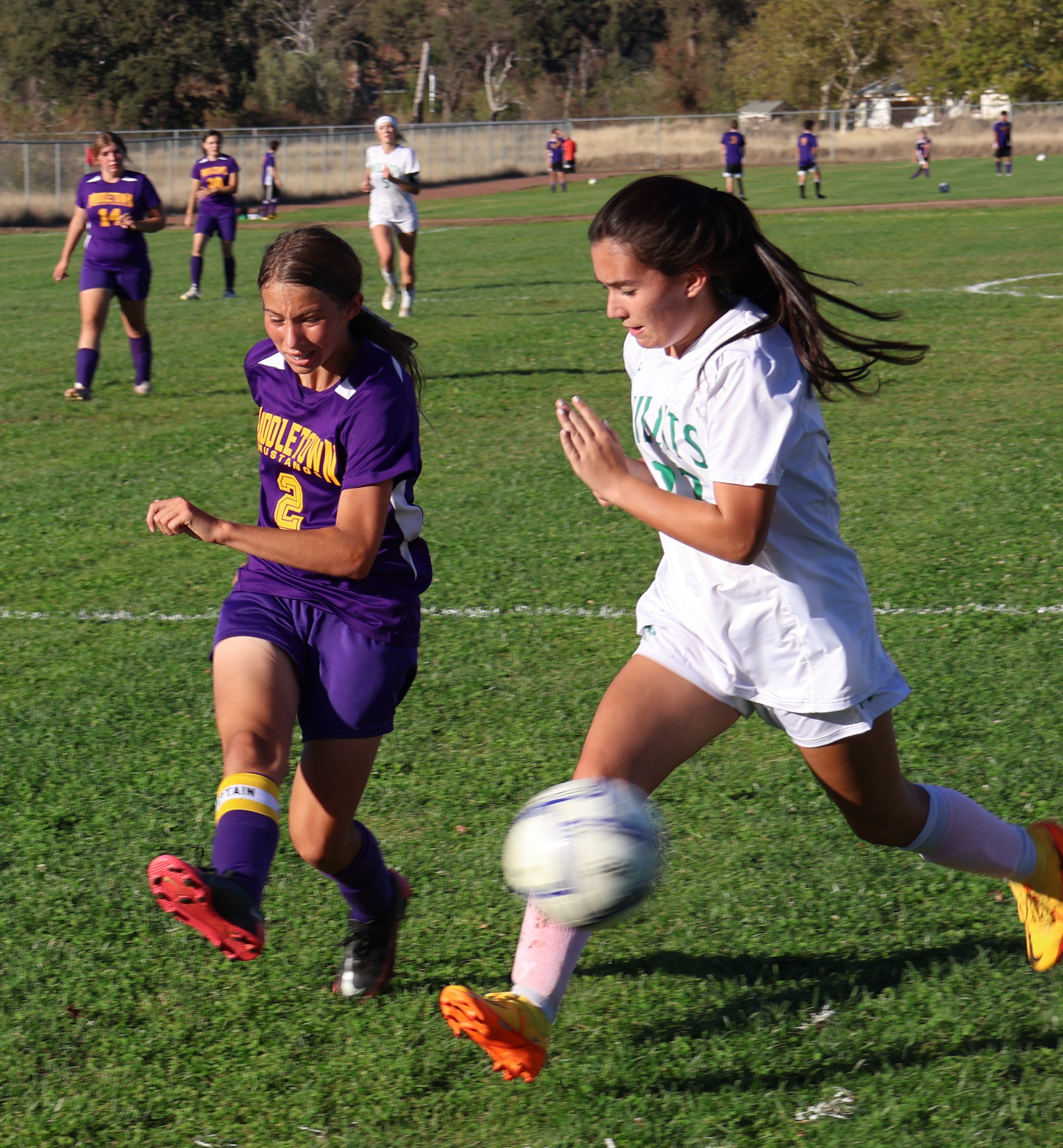 Jenna Tufo blasts a shot past a Willits defender and into the net for her eighth and final goal of the game. (Photos by Brian Sumpter)