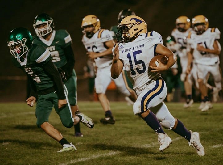 Middletown's Elijah Diaz turns the corner against the St. Patrick-St. Vincent defense Friday night in Vallejo. (Photos courtesy of Geri Costlow Photography)