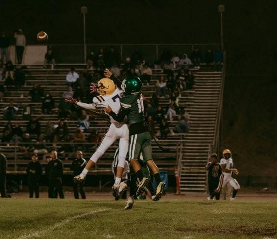 Middletown wide receiver Troy Taber pulls in a pass despite the best efforts of the St. Patrick-St. Vincent secondary on Friday night in Vallejo. (Photos courtesy of Geri Costlow Photography)