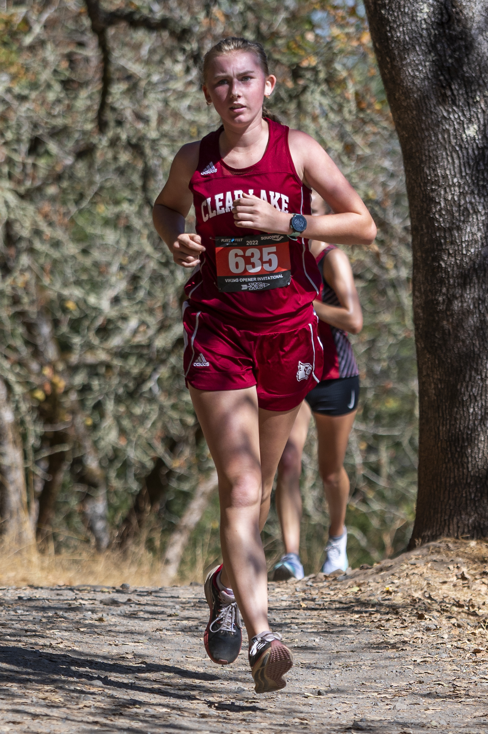 Clear Lake High School junior Hannah Garrity makes her way along the 2.0-mile Spring Lake Course in Santa Rosa on Saturday during the annual Viking Invitational cross country meet. Garrity placed sixth in the junior girls race in 13 minutes, 5.4 seconds, the fastest time among all Coastal Mountain Conference runners entered. Garrity reached the state meet a year ago and is looking for a return trip in 2022. Middletown runners also participated. See the complete story on Page 7. (Photo courtesy of Michael Lucid)