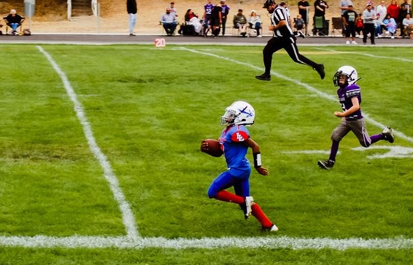 Lower Lake's Malakhi Brown sprints down the sideline for a touchdown in a 19-13 win over Fort Bragg in pee wee youth football action Saturday in Lower Lake. (Photos by Audreyona Rhiannon Photography)