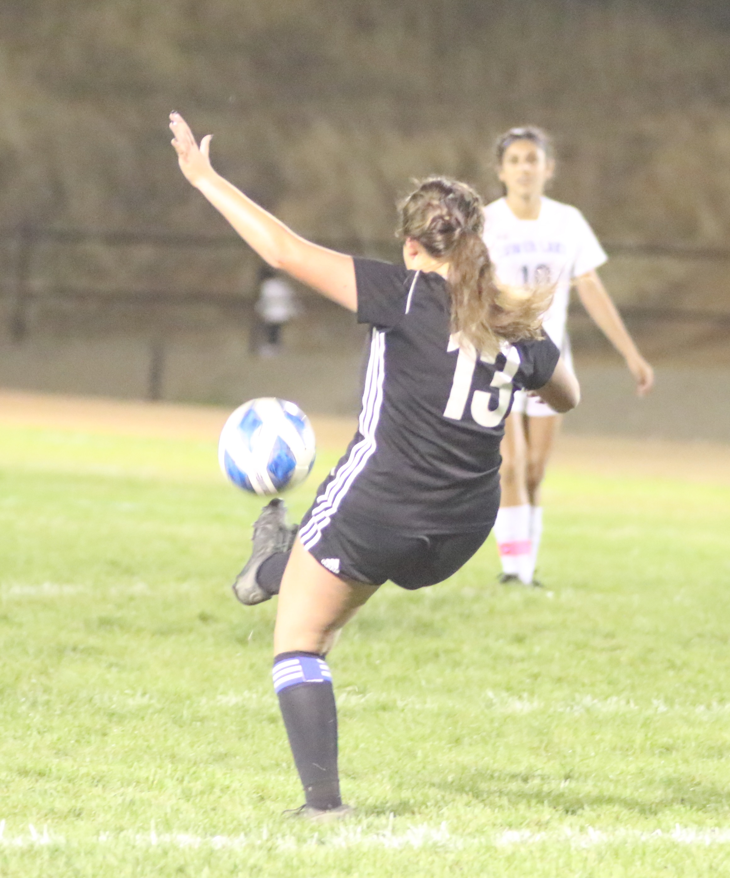 Clear Lake's Grace Gomez puts her leg into this kick. (Photos by Minenna Photography)