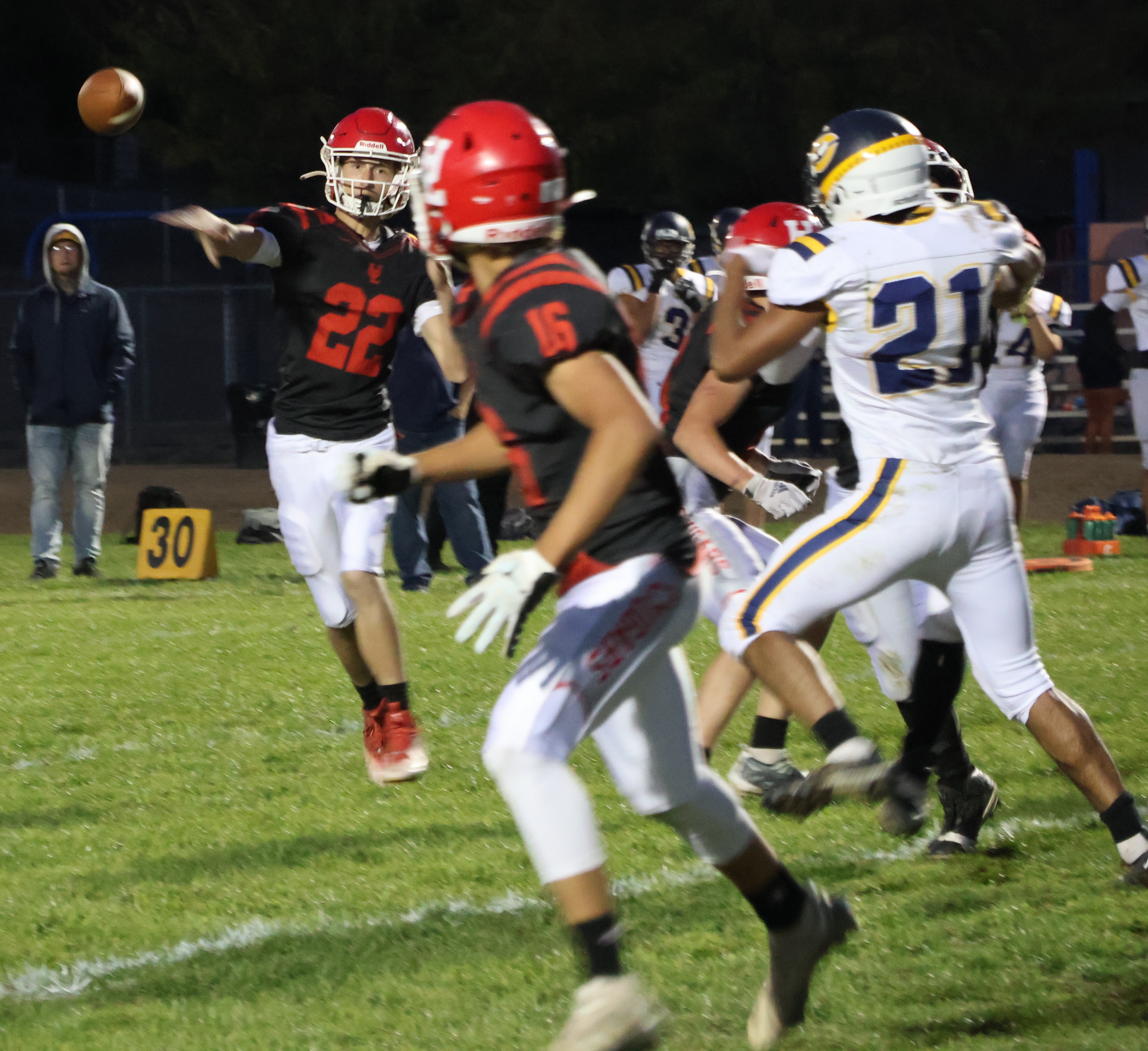 Upper Lake quarterback Jerod Rosales delivers a pass in the direction of running back Delaney Allison during the Cougars' 42-6 league win over Cornerstone Christian of Antioch. (Photos by Brian Sumpter)