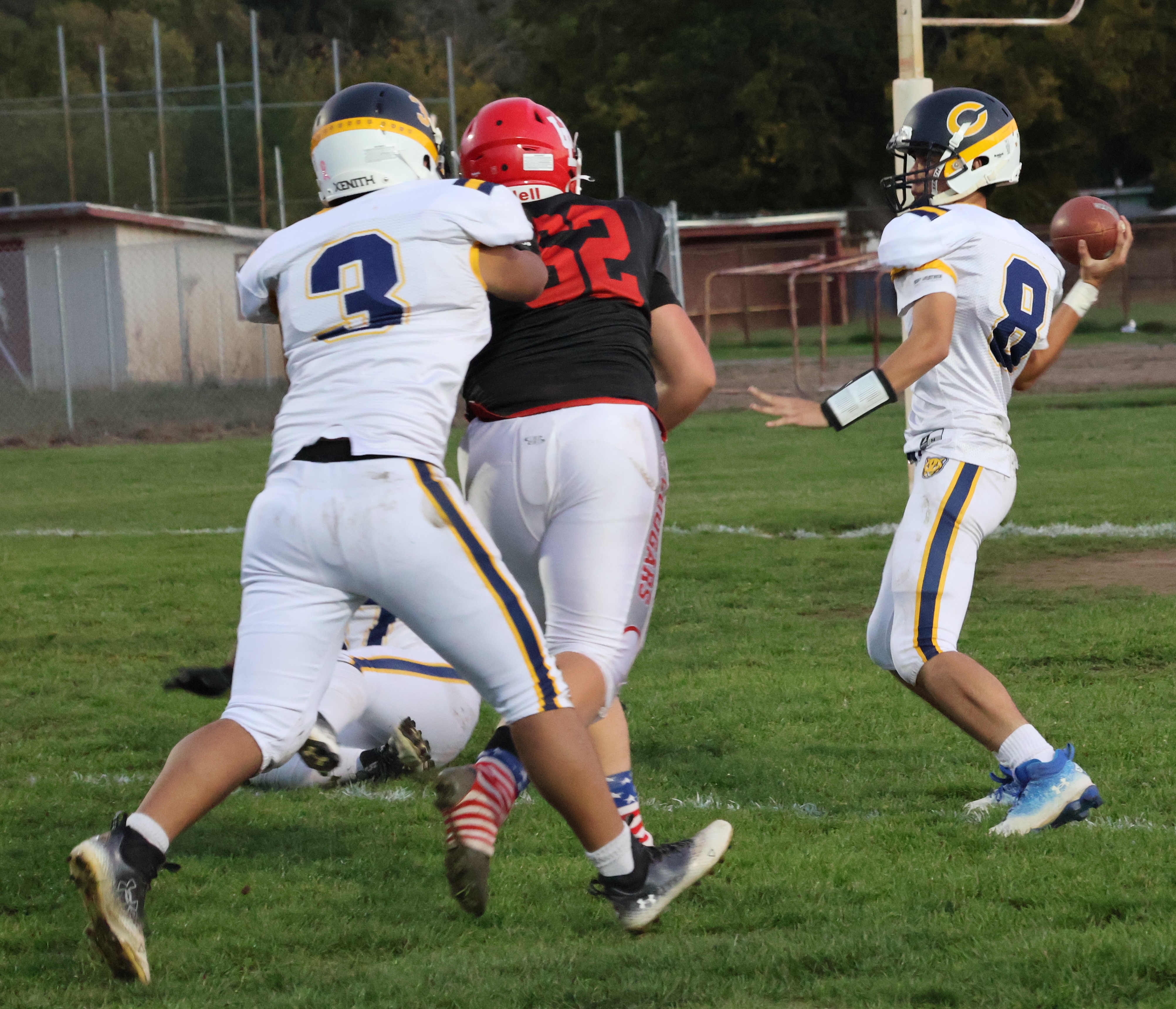 Upper Lake's Gabe Burris puts the pressure on Cornerstone Christian quarterback Elijah Castillo. The Cougars sacked Castillo three times. (Photos by Brian Sumpter)