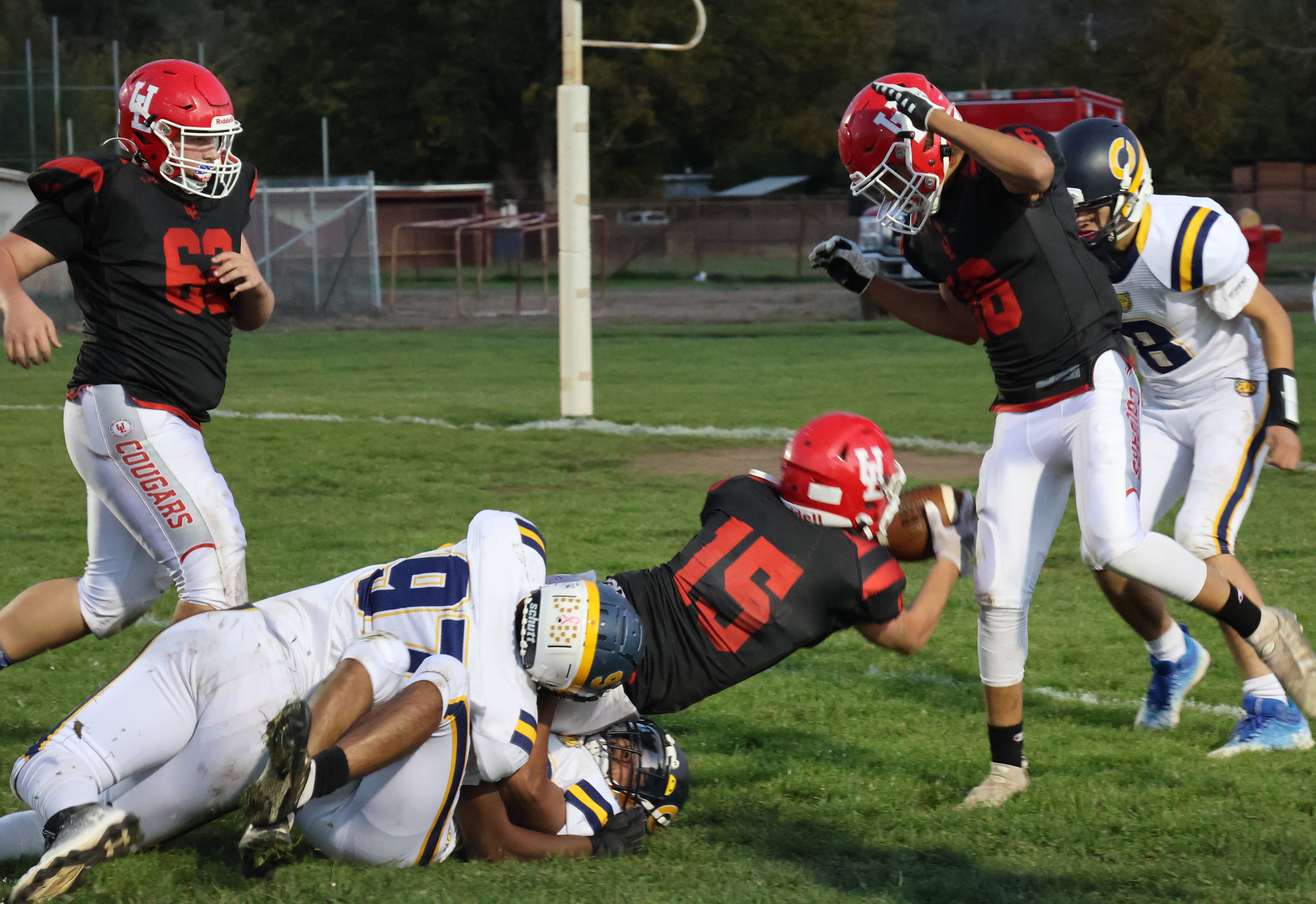 Two Cornerstone Christian defenders bring down Upper Lake's Jonathan Barnes short of the goal line on this conversion run attempt. (Photos by Brian Sumpter)