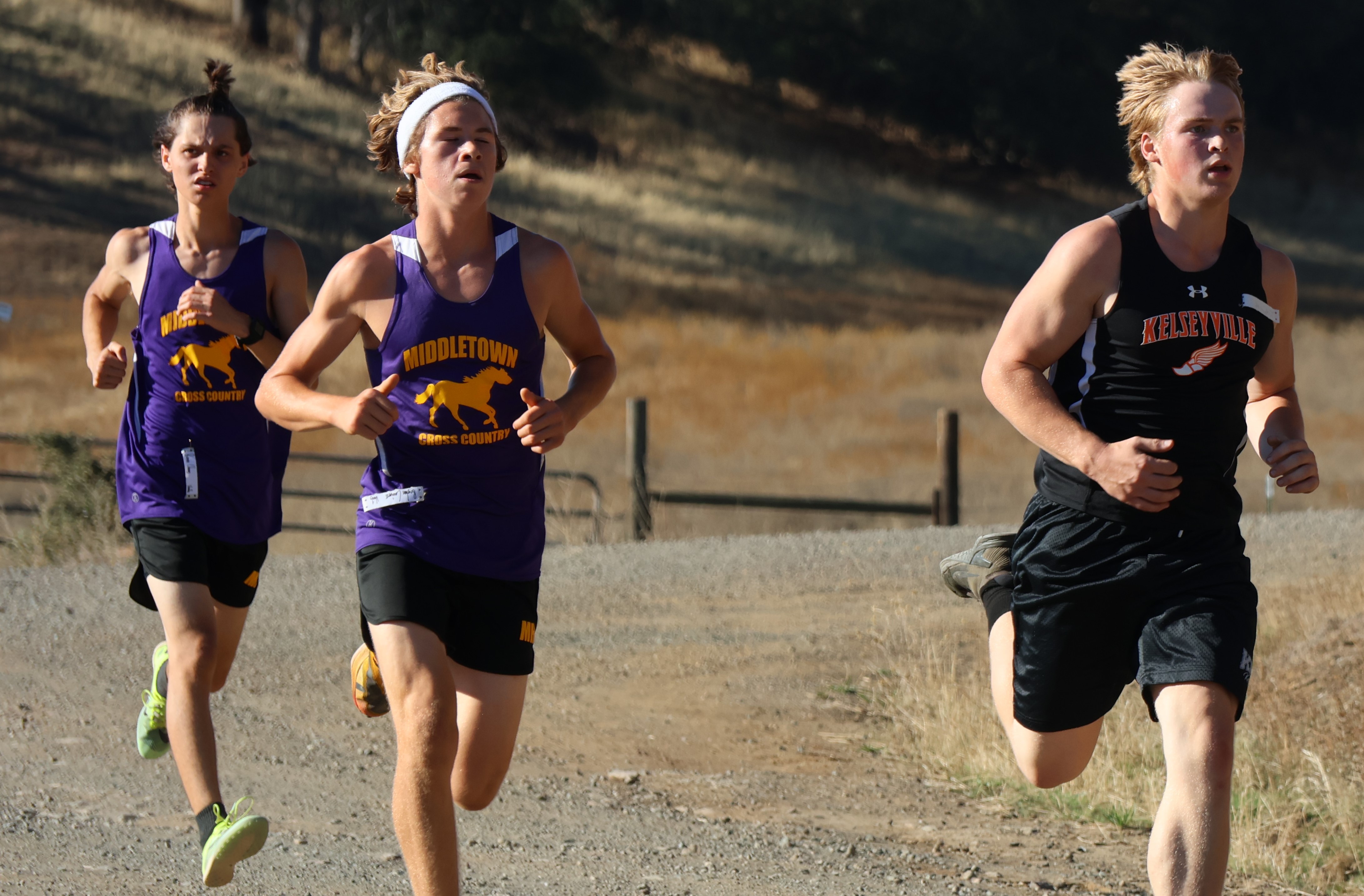 From left to right are Middletown's Baron Chang and Bryton Caviness and Kelseyville's Triton Marlowe. Caviness ended up third in the varsity boys race with a time of 19 minutes, 59 seconds. Marlowe was right behind him in fourth place at 20:01 and Chang came in fifth in 20:05. (Photos by Brian Sumpter)