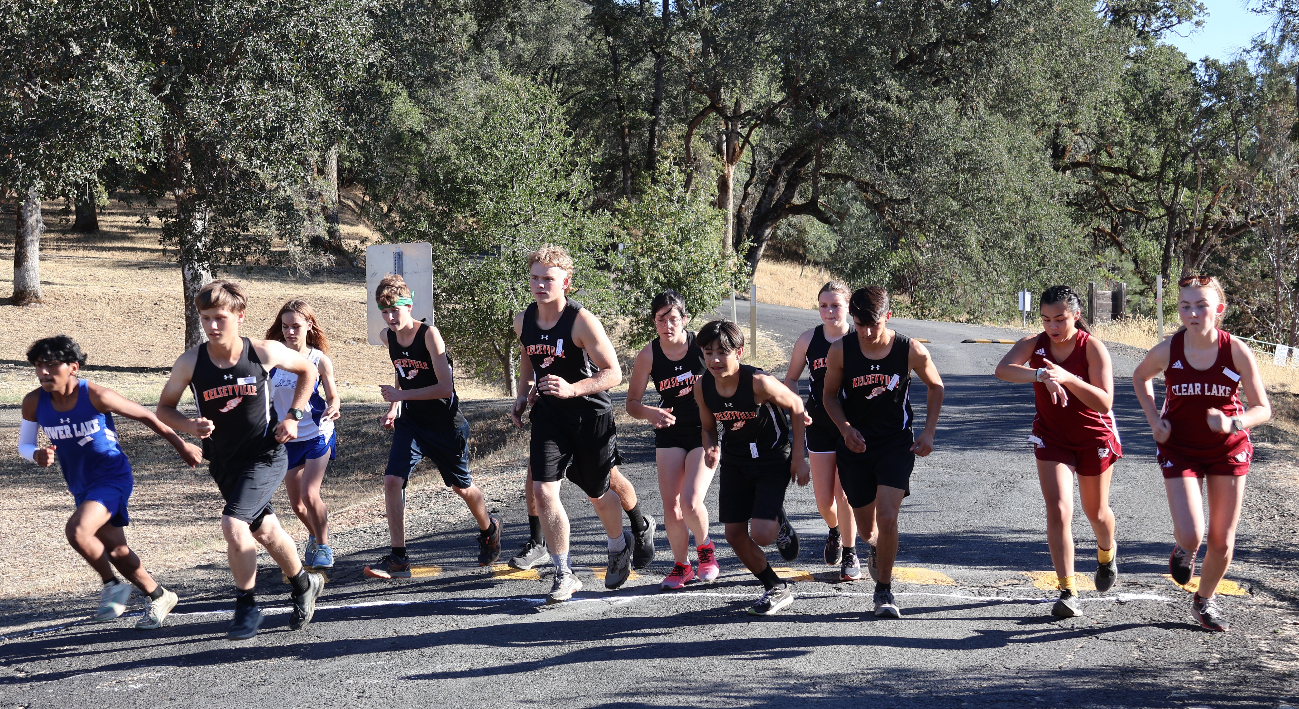 Runners break from the starting line Wednesday at Highland Springs. Varsity boys winner Jose Hernandez of Lower Lake is on the far left while girls winner Hannah Garrity of Clear Lake is on the far right. (Photos by Brian Sumpter)