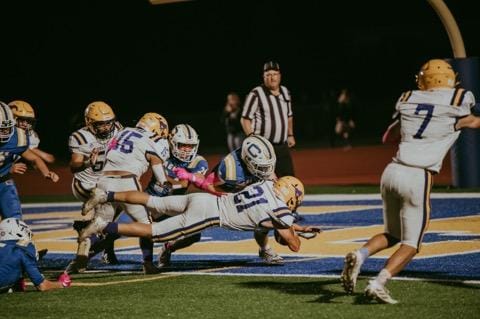 Middletown running back Jacob Urbina scores in the first quarter for Middletown. Urbina's 1-yard run with seconds remaining in the fourth quarter put the Mustangs ahead to stay in a 36-29 league win at Cloverdale on Friday night. (Photos courtesy of Geri Costlow)