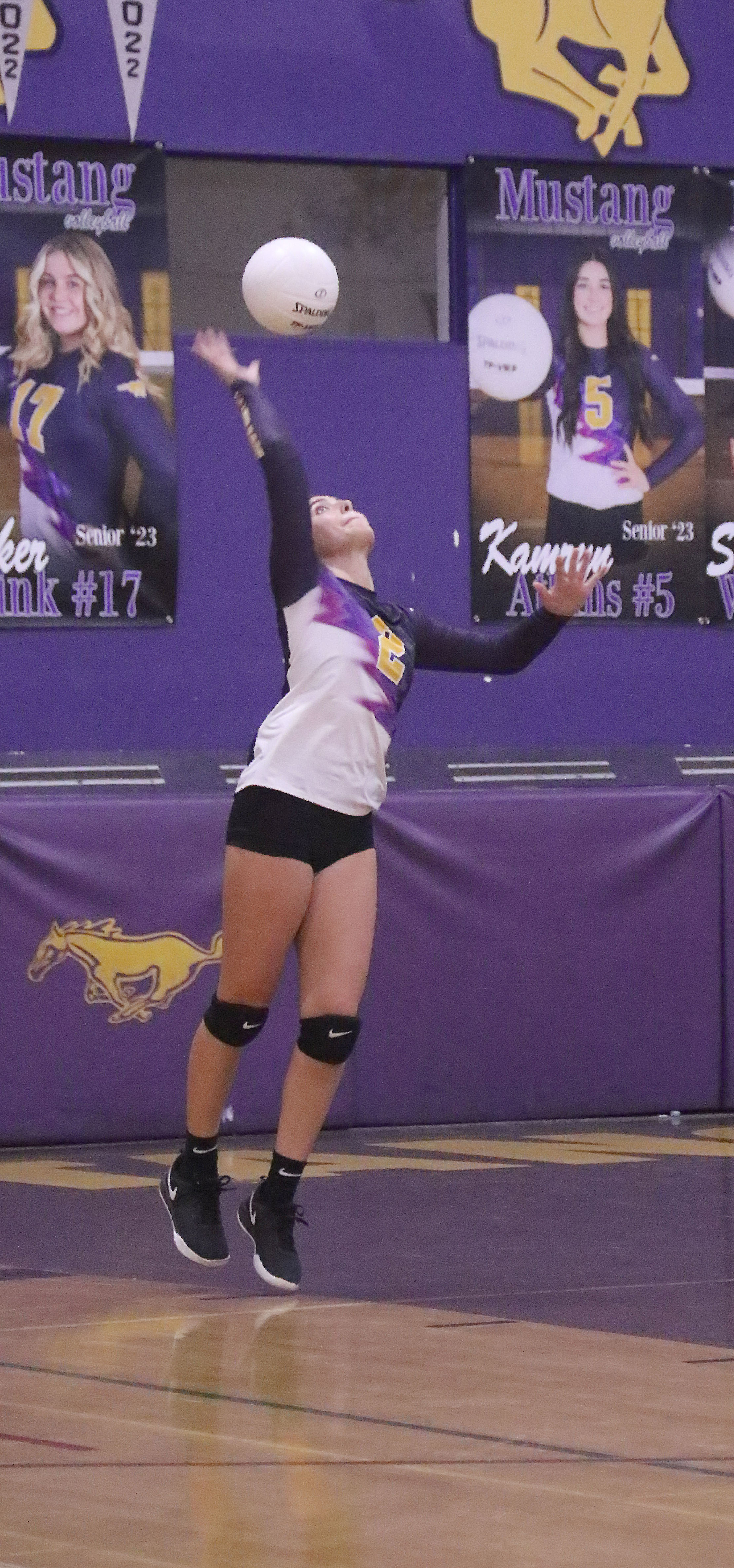 Skylar Williams serves for Middletown during its five-set loss to Kelseyville on Tuesday night. (Photos by Minenna Photography)