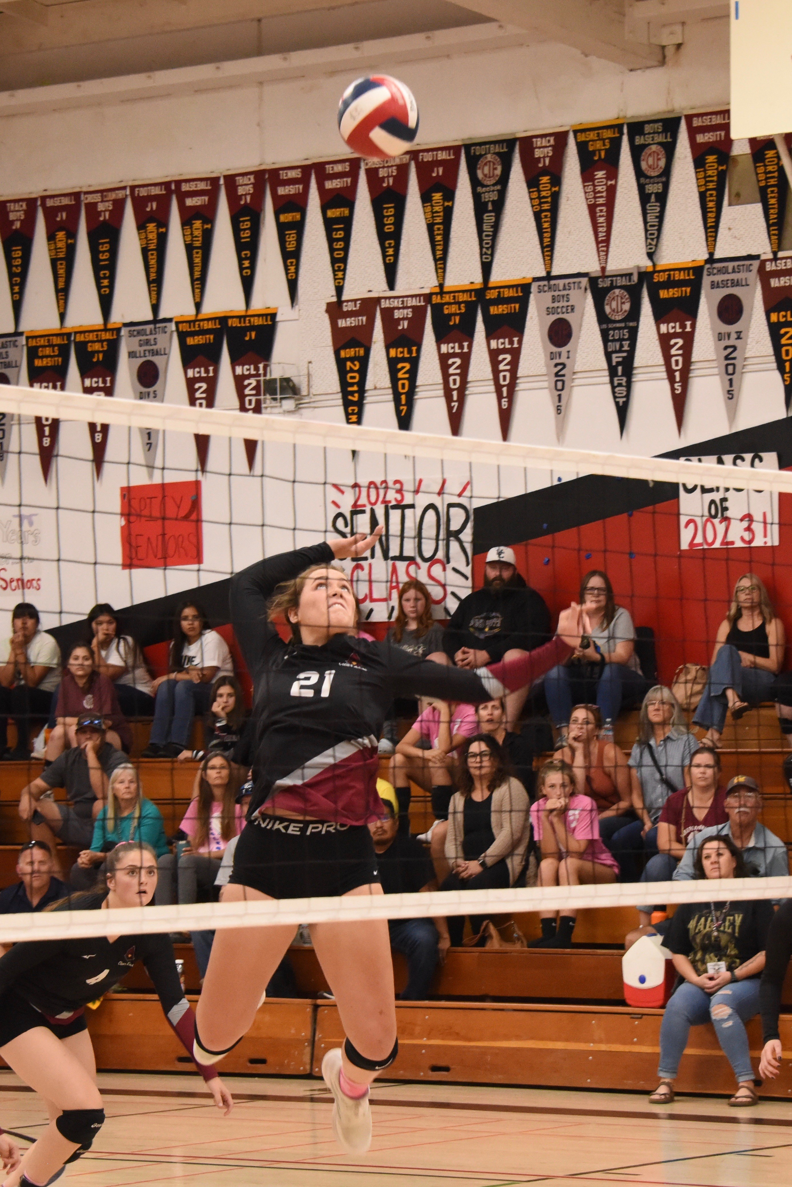 Clear Lake's Abby Mertle winds up on a kill attempt as teammate Montana Wells looks on. (Photos courtesy of Trett Bishop)