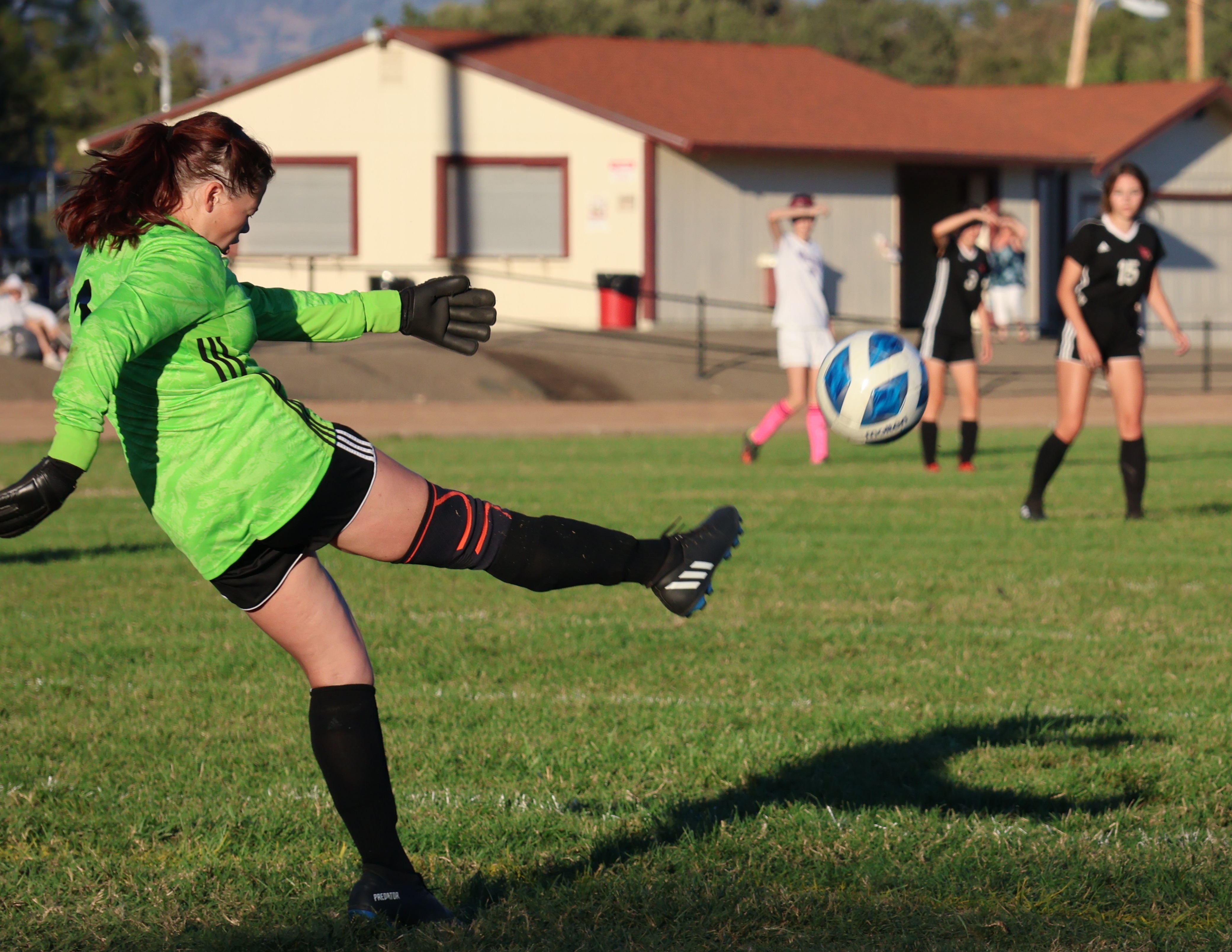Clear Lake keeper Kiley Bartell puts her leg into this goalie kick during action in the first half. (Photos by Brian Sumpter)