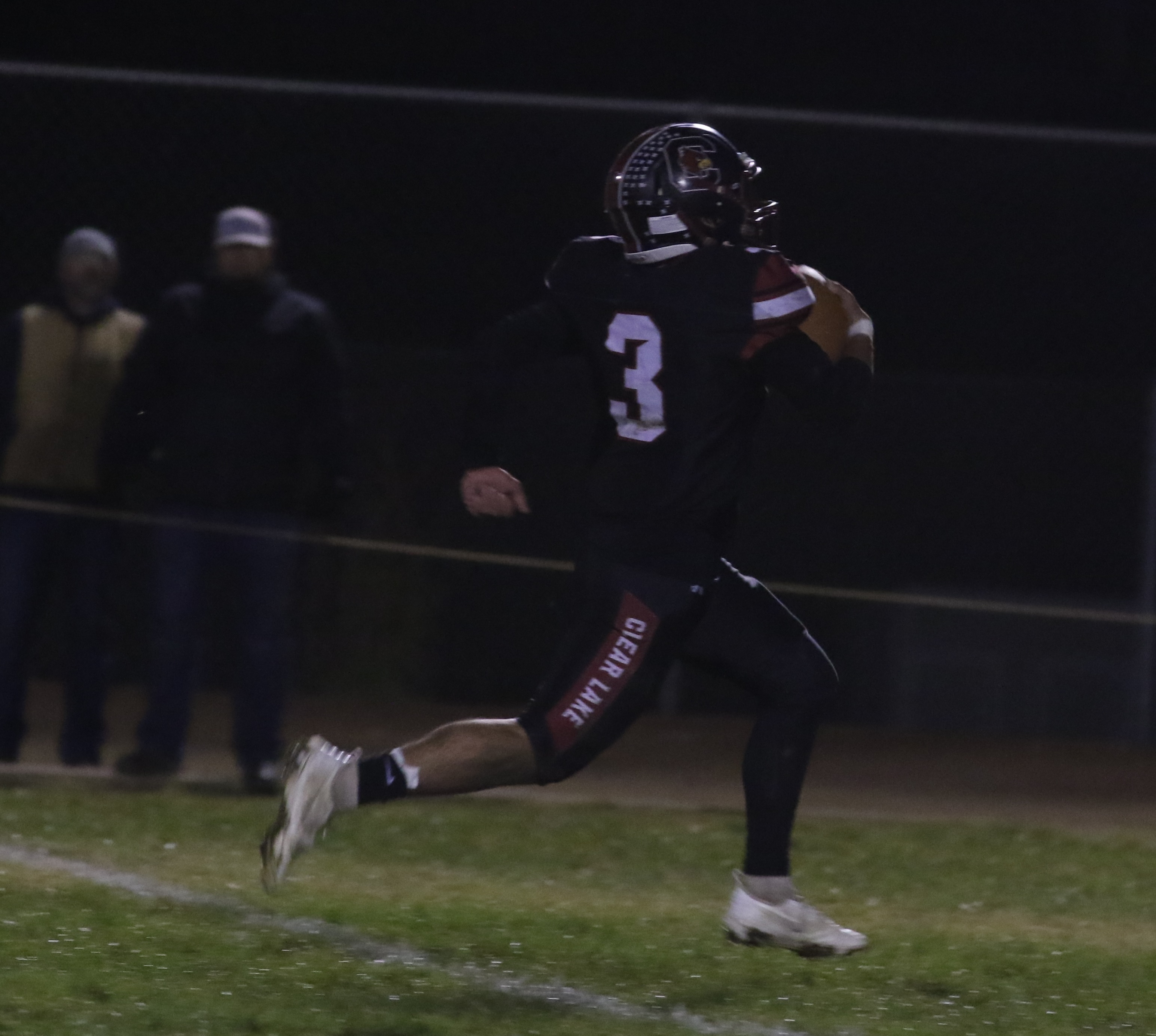 Clear Lake's Hank Ollenberger closes in on the end zone during his 95-yard kickoff return for a touchdown late in the first quarter against Cloverdale. The Cardinals were trailing 13-0 when Ollenberger's lighting-quick strike began a run of 47 unanswered points by Clear Lake in its 47-13 playoff win Friday night in Lakeport. (Photos by Minenna Photography)