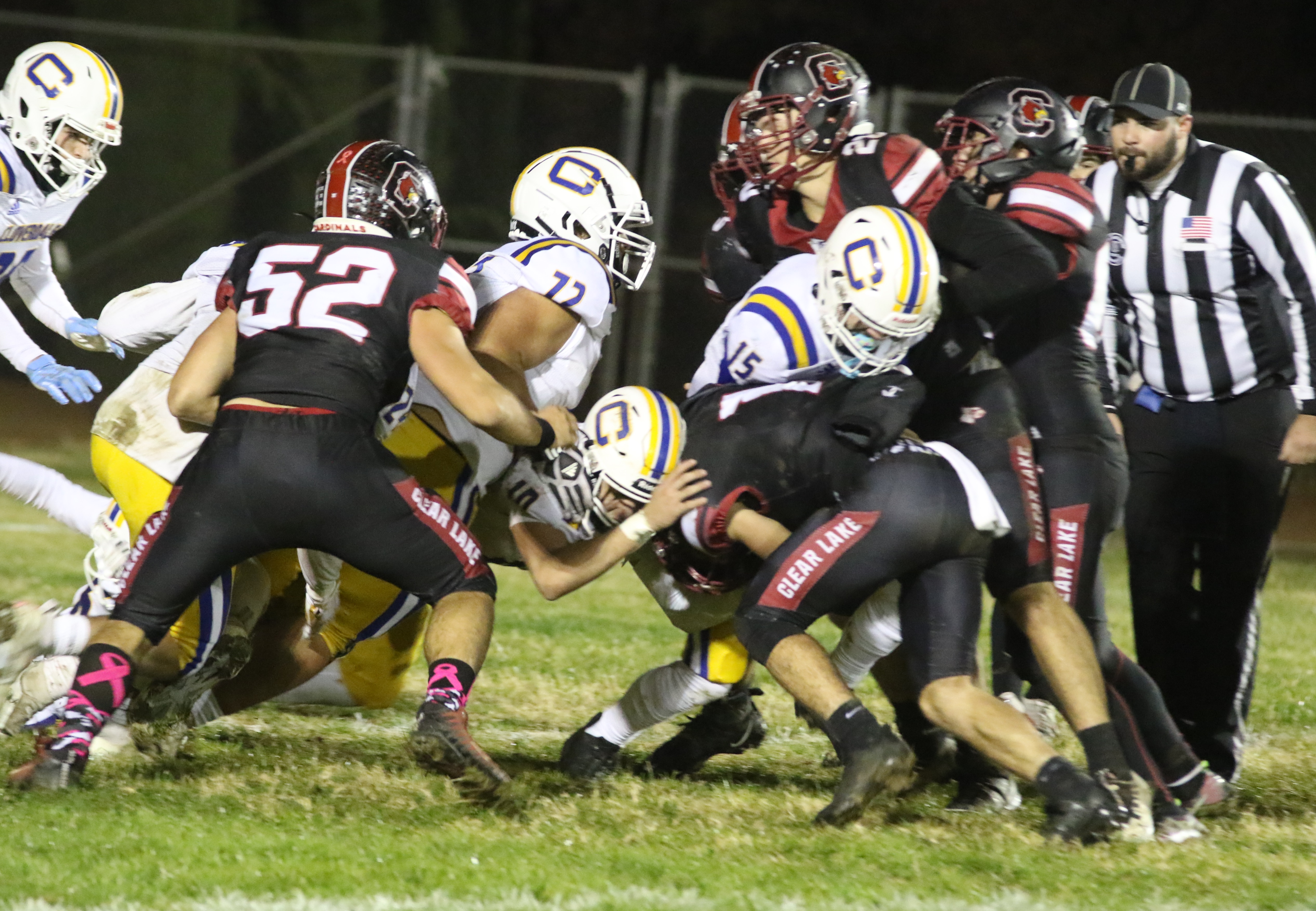 Clear Lake's defense stops Cloverdale quarterback Mason Caturegli on a fourth-down run, a play that would be repeated often throughout the night. (Photos by Minenna Photography)