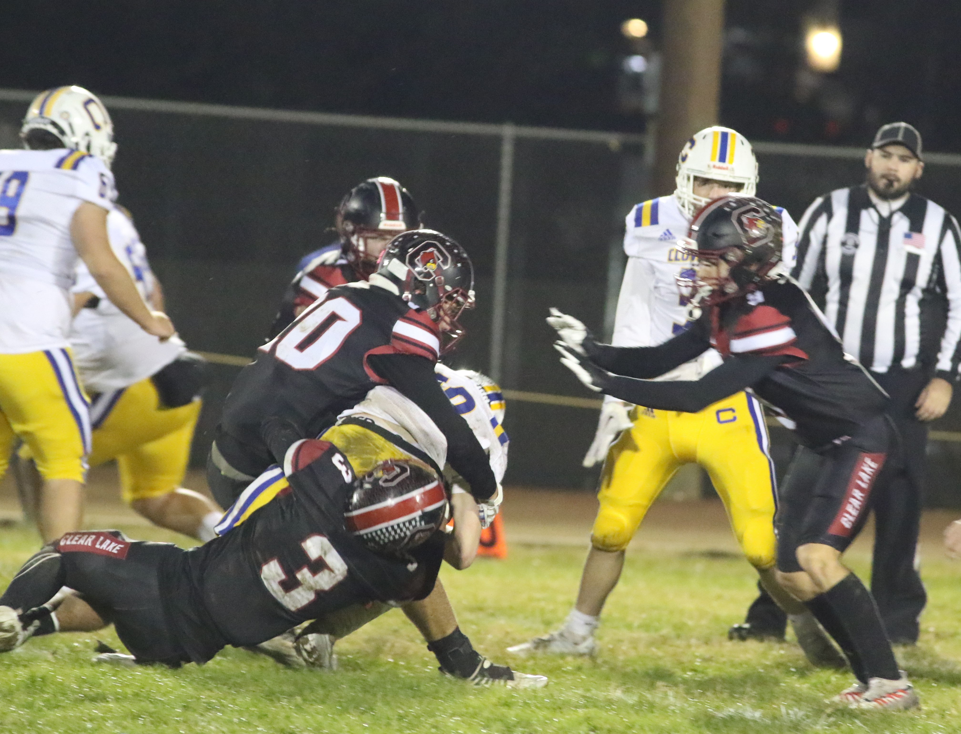 Clear Lake's defense, including Hank Ollenberger (3) corrals Cloverdale quarterback Mason Caturegli. (Photos by Minenna Photography)