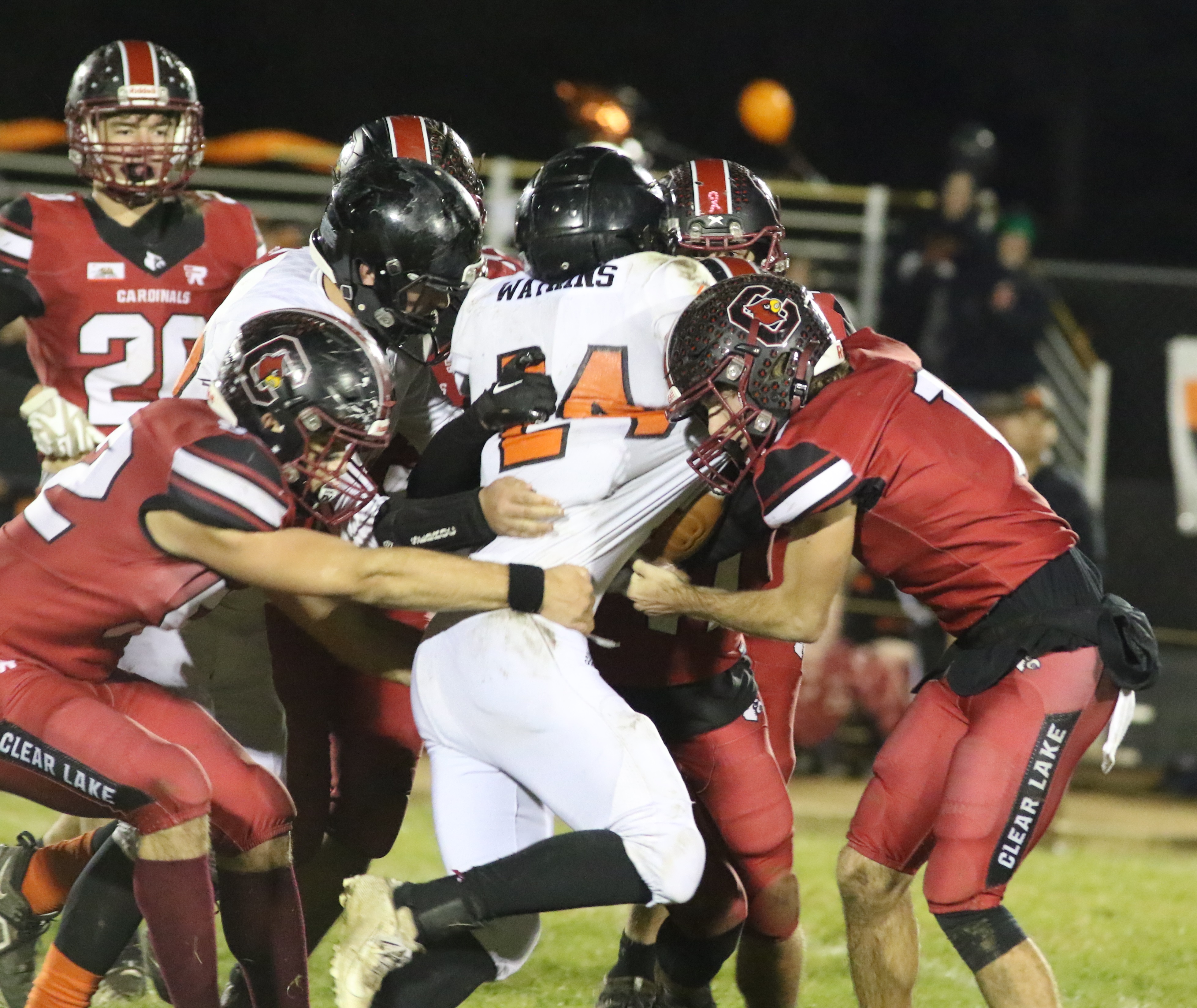 Kelseyville running back Kyle Watkins drags the pile forward during Friday's action. Watkins finished with 148 rushing yards on 23 carries and a touchdown in the Knights' 28-22 semifinal-round play loss to Clear Lake. (Photos by Minenna Photography)