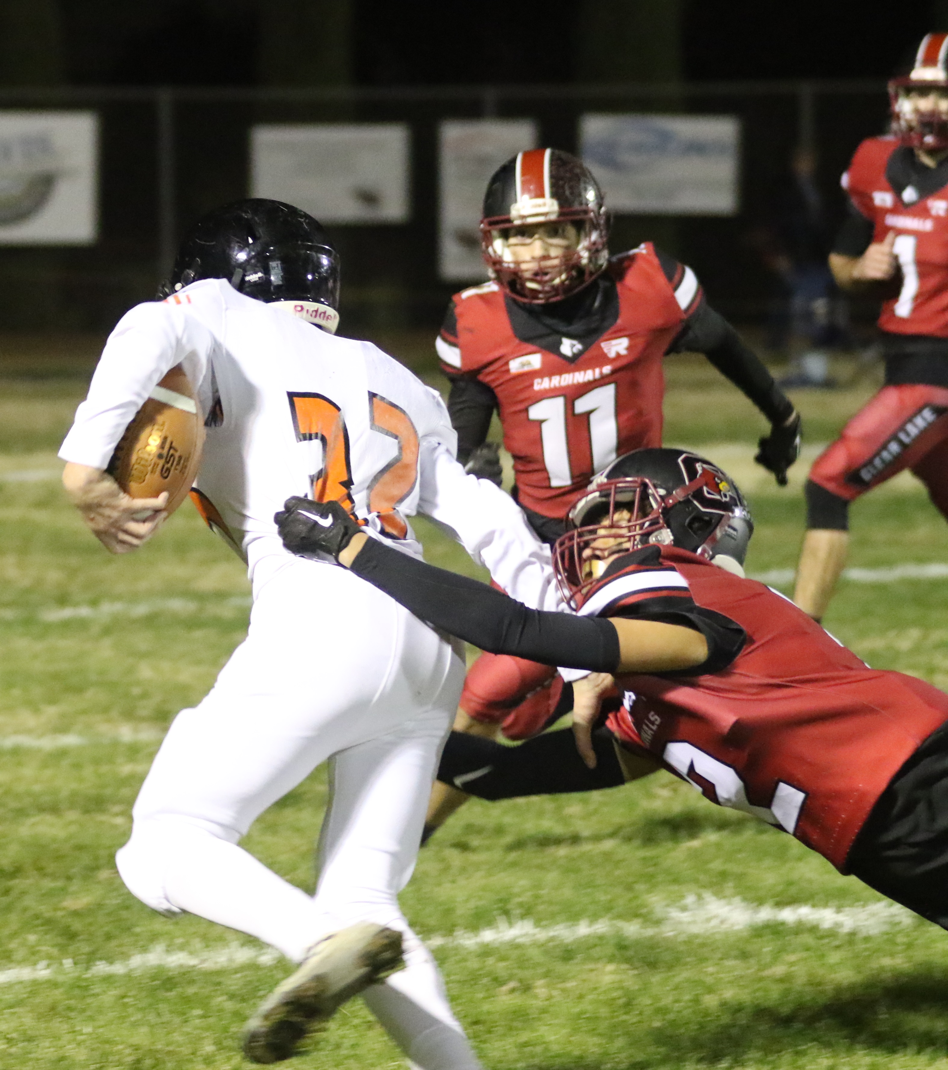 Kelseyville's Samuel Vanoven breaks it to the outside as Clear Lake's Graden Greer tries to make the tackle. (Photos by Minenna Photography)