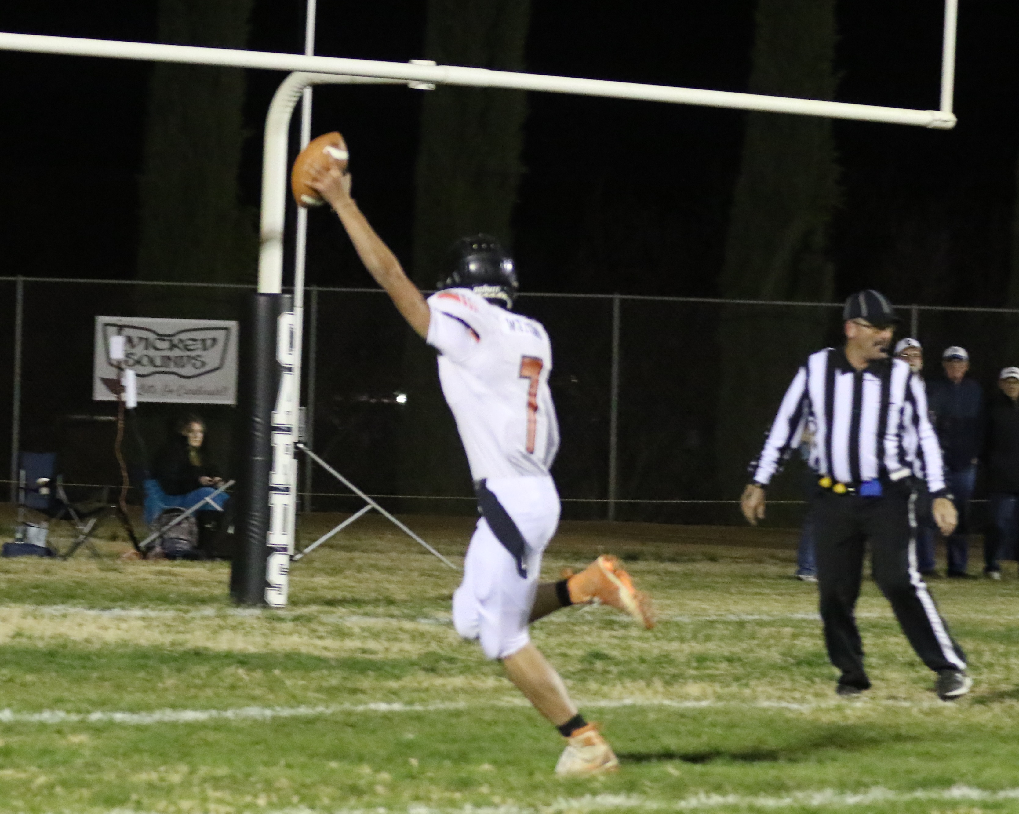 Kelseyville quarterback Luke Watkins scores on a 28-yard keeper to give the Knights the lead early in the first quarter. They added the two-point conversion for an 8-0 lead. (Photos by Minenna Photography)