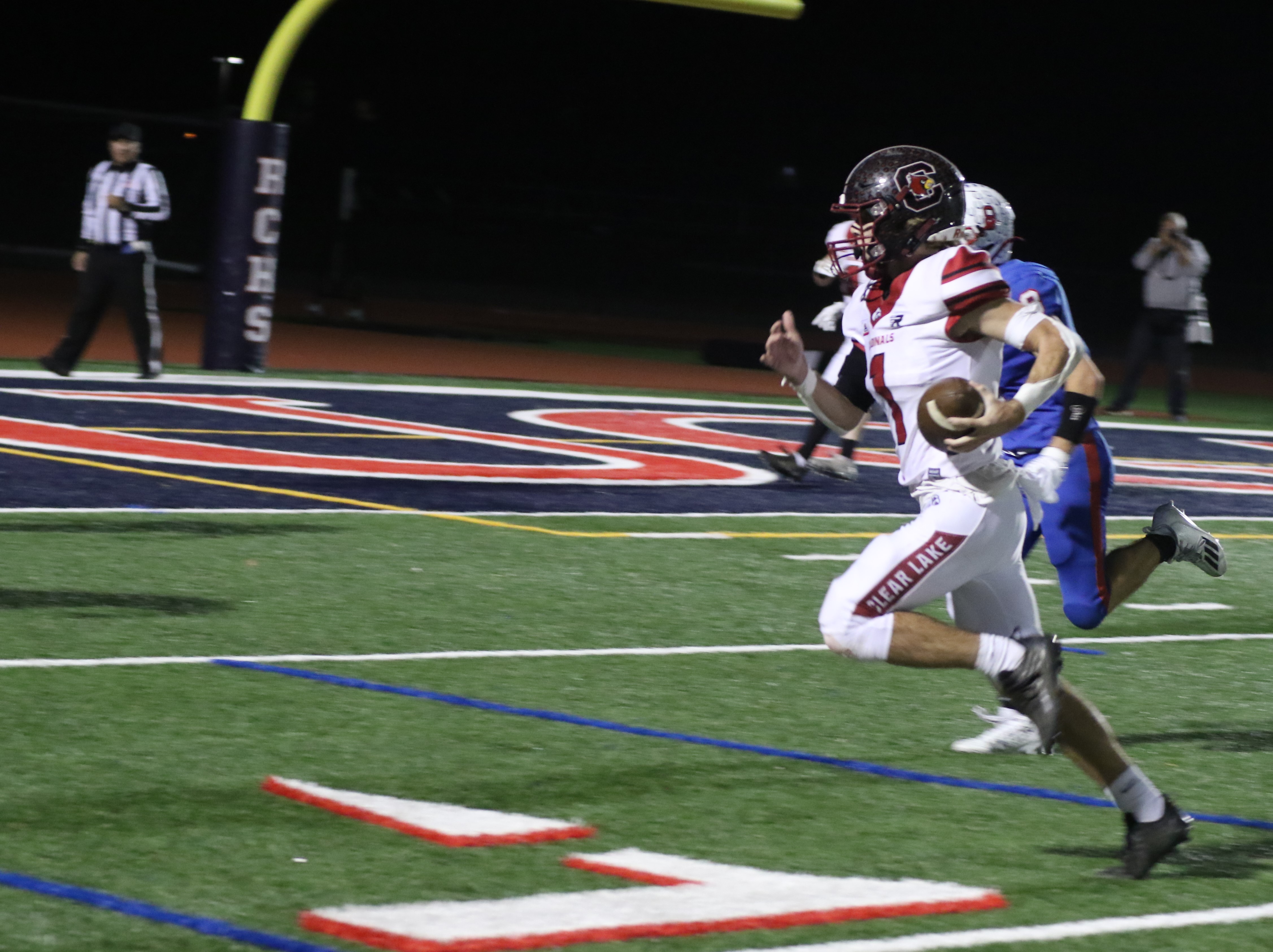 Clear Lake quarterback Jake Soderquist scrambles for a first down during the Cardinals' game-winning drive late in the fourth quarter. (Photos by Minenna Photography)