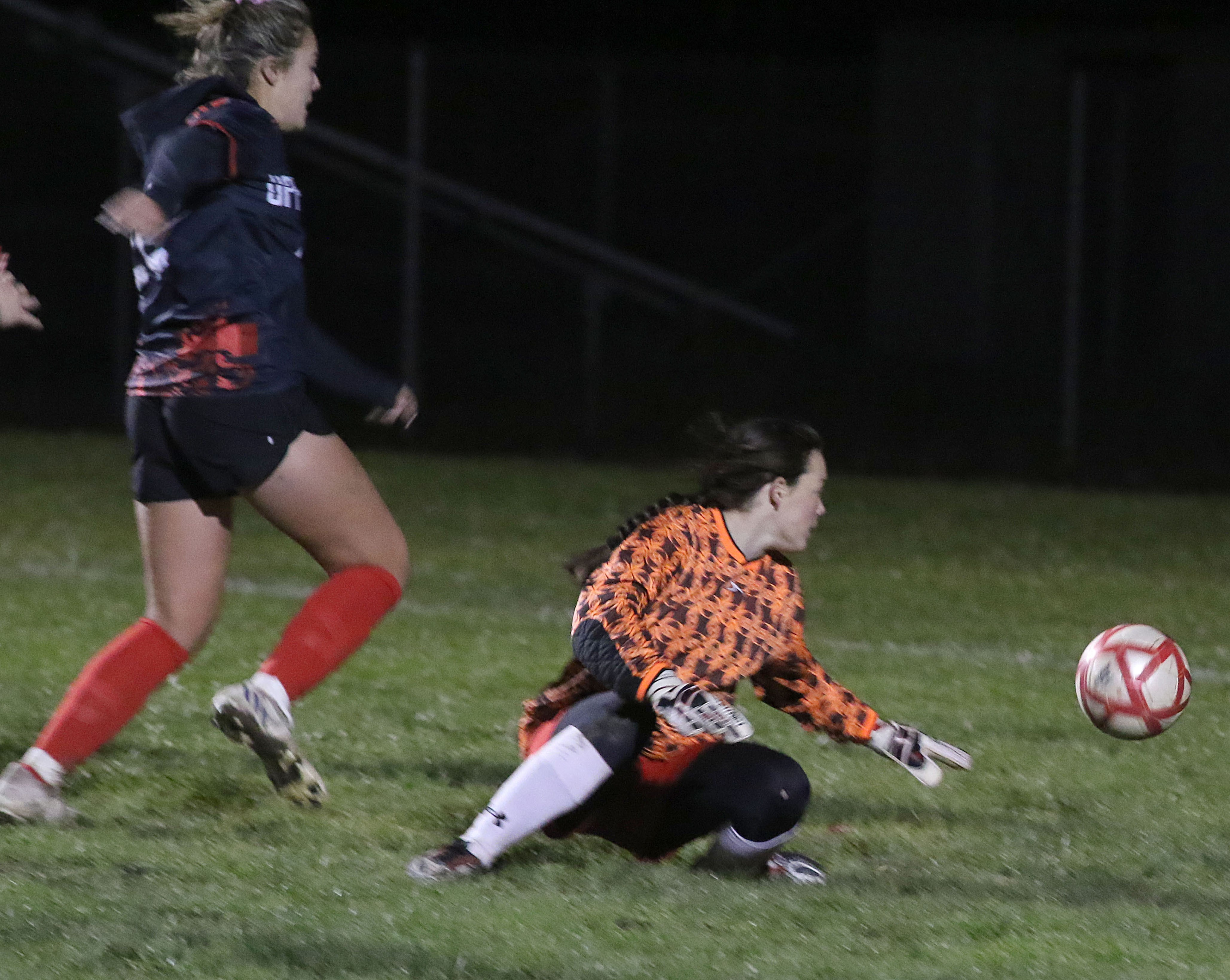 Upper Lake's Nya Marcks scores late in the second half of regulation to pull the Cougars into a 2-2 tie with Ferndale on Wednesday night in Upper Lake. The Cougars went on to win the semifinal-round playoff game 3-2 in overtime and remain undefeated on the season. (Photos by Minenna Photography)