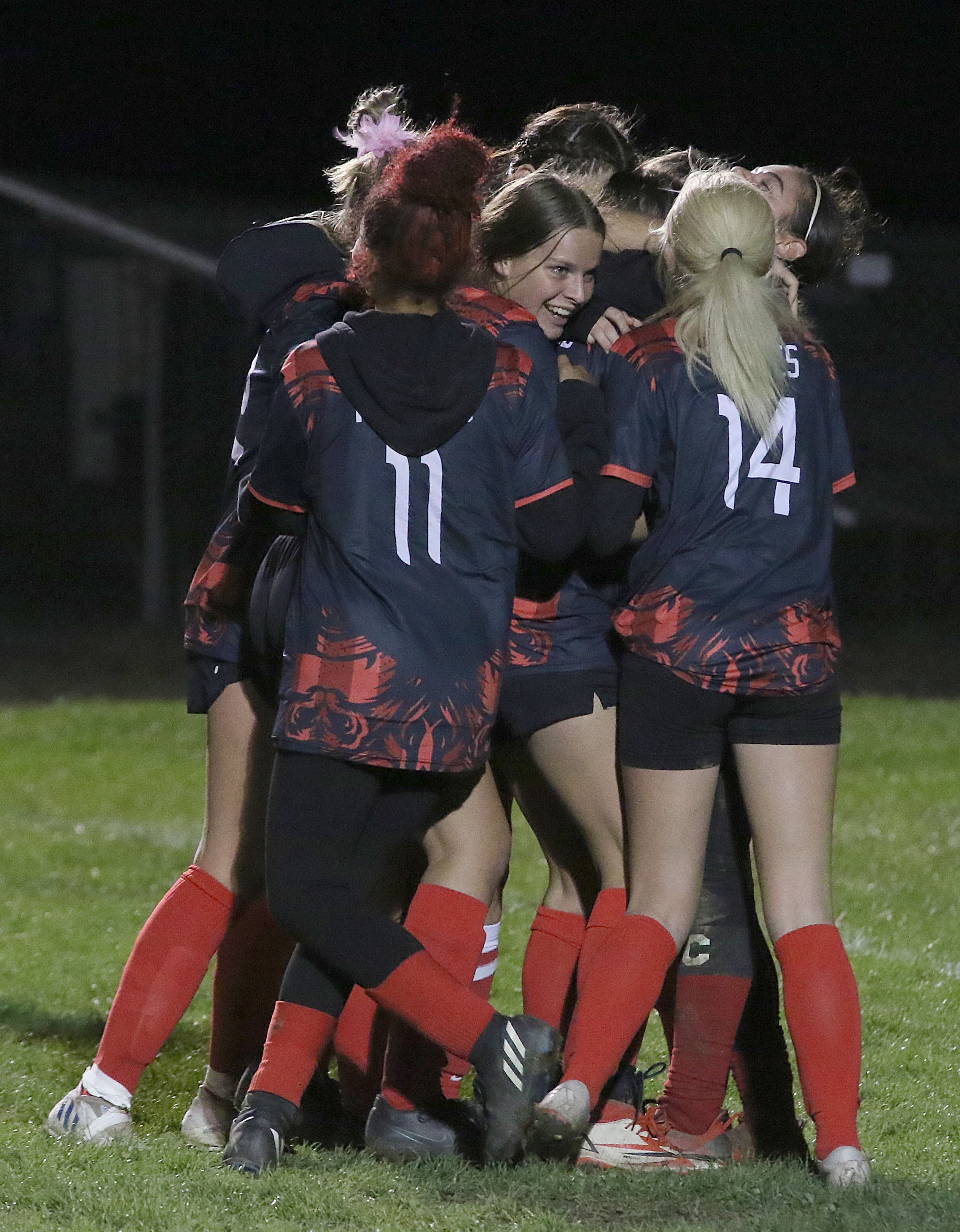 Upper Lake players congratulate Jayme Zimmerschied on her game-winning goal in overtime Wednesday night. (Photos by Minenna Photography)