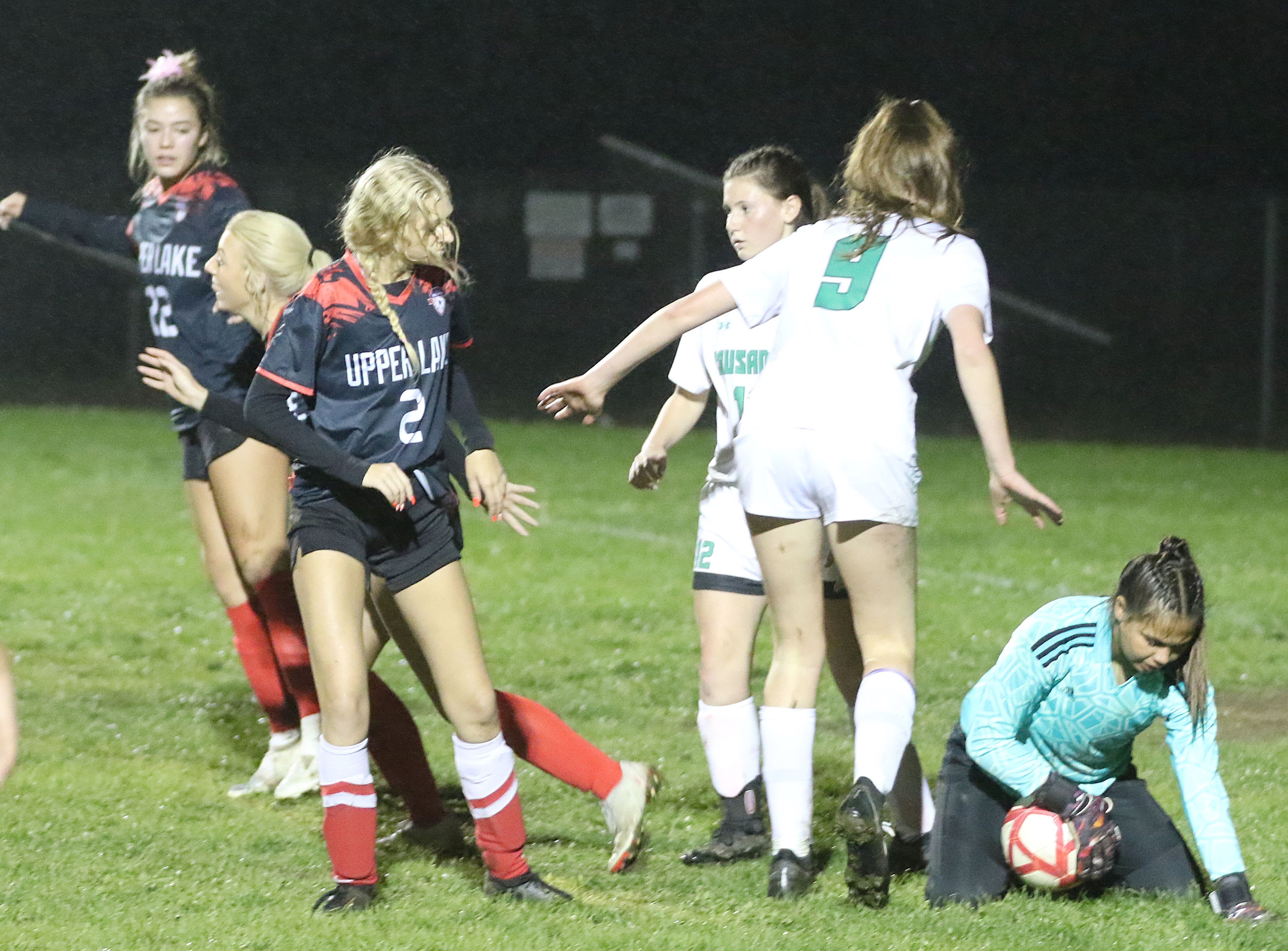 The St. Bernard's keeper stops a shot on goal by Upper Lake as Upperr Lake's Tristin Rhodes (2) looks on. (Photos by Minenna Photography)