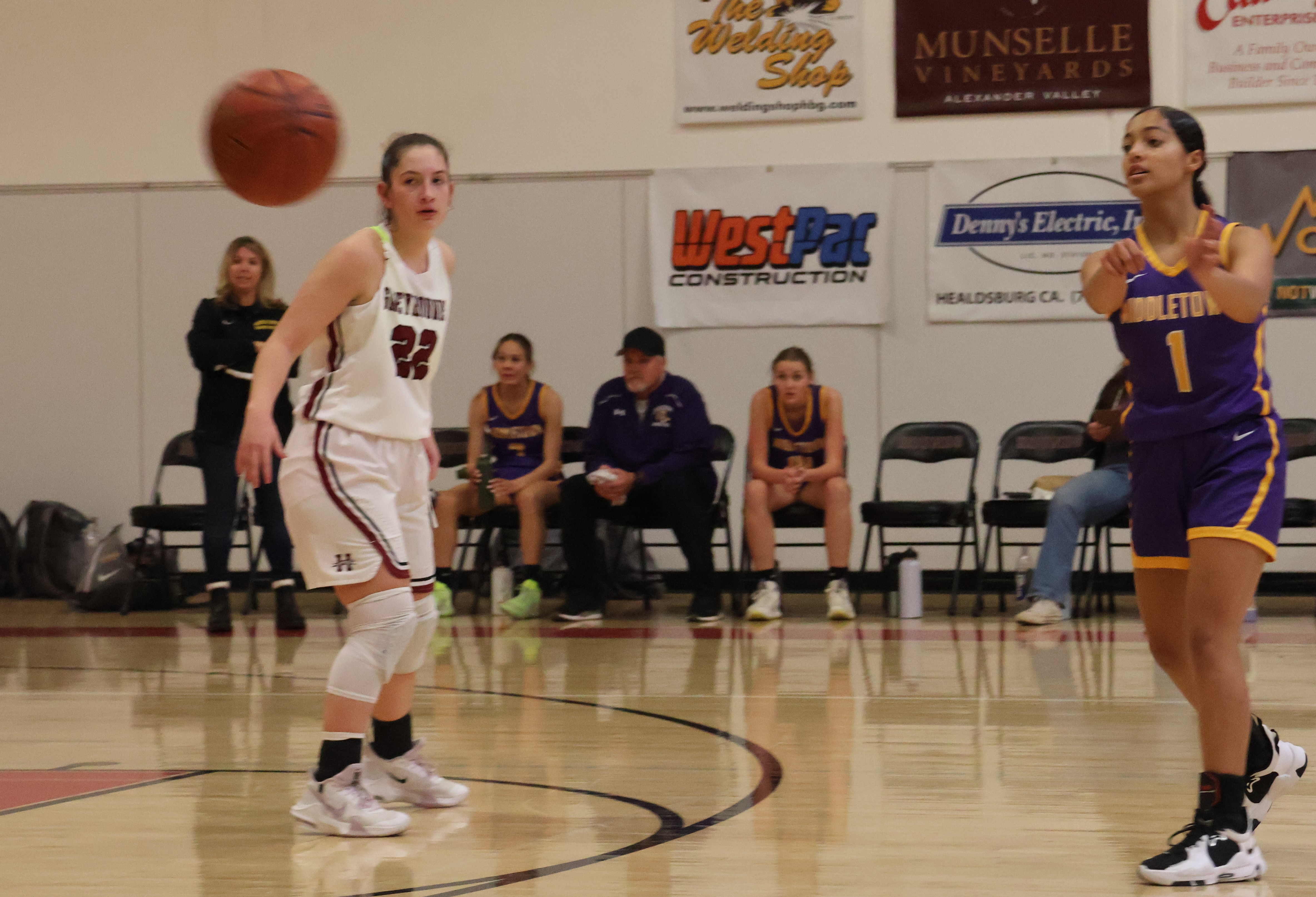 Middletown's Jaidyn Brown works the ball around the perimeter during Tuesday's action in Healdsburg. The Mustangs handed an undefeated Greyhounds squad its first loss of the season. (Photos by Brian Sumpter)