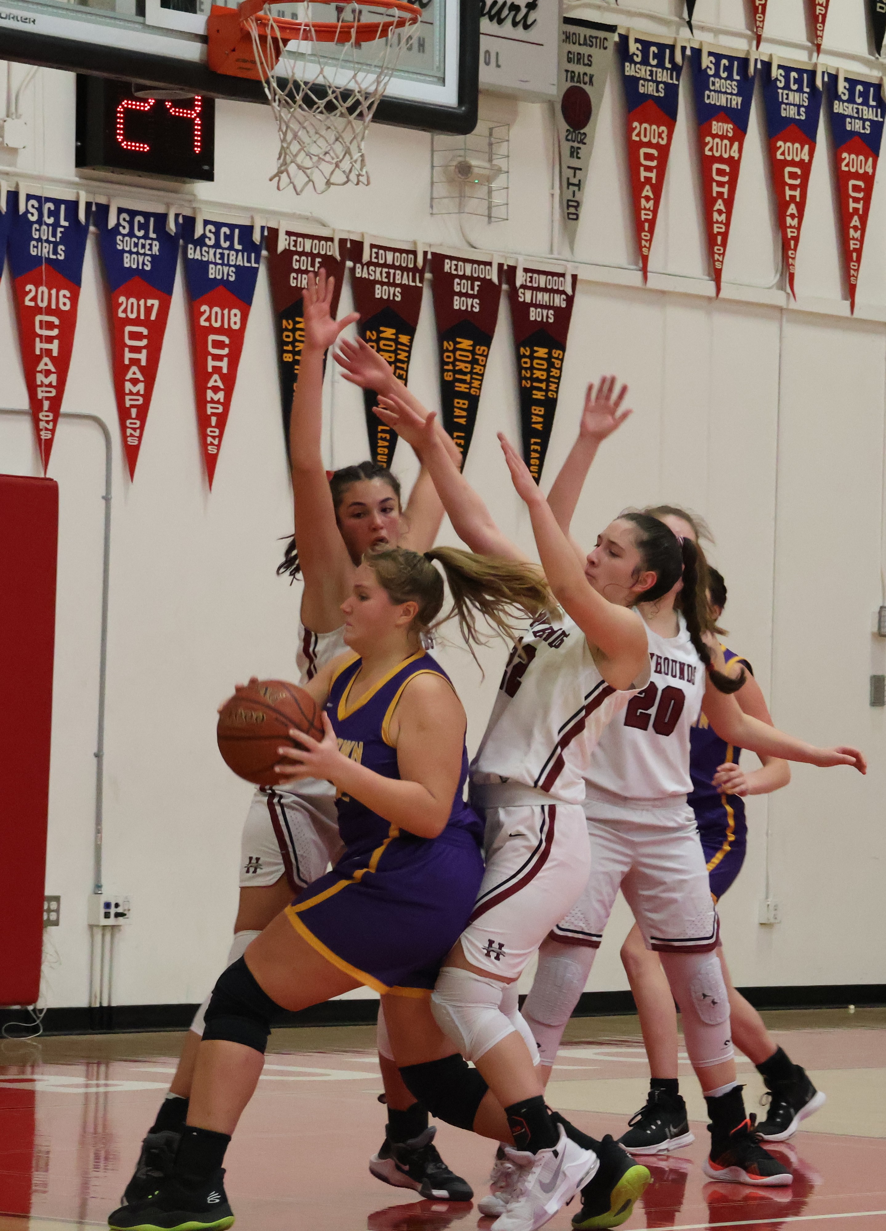 Middletown's Amanda Hart draws a crowd of Healdsburg defenders down low. Hart's 18 points powered the Mustangs to a 49-48 victory. (Photos by Brian Sumpter)