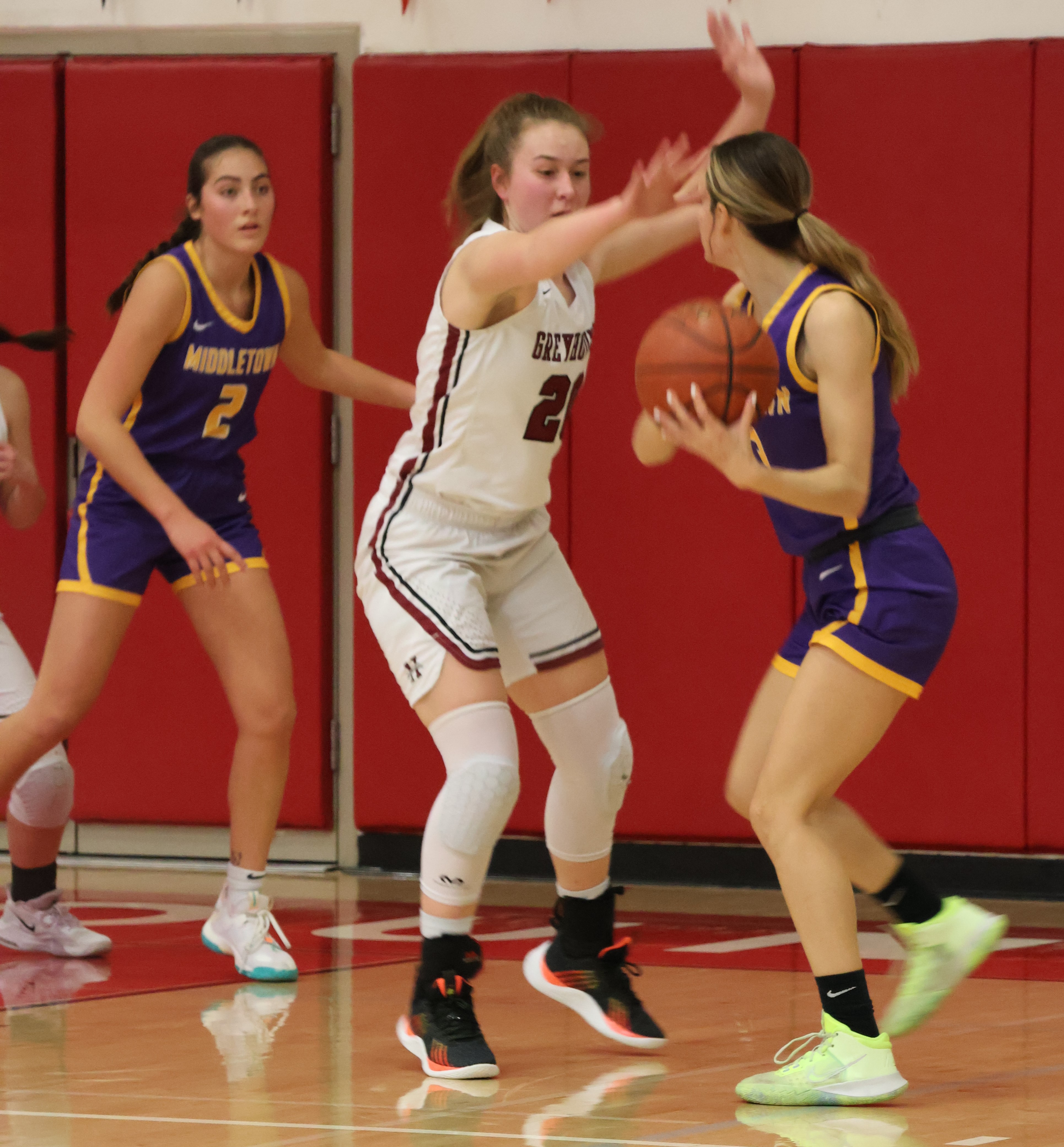 Middletown's Abigail Tacla looks for a way to get the ball to teammate Skylar Williams as Healdsburg's Maddie Wagner defends. (Photos by Brian Sumpter)