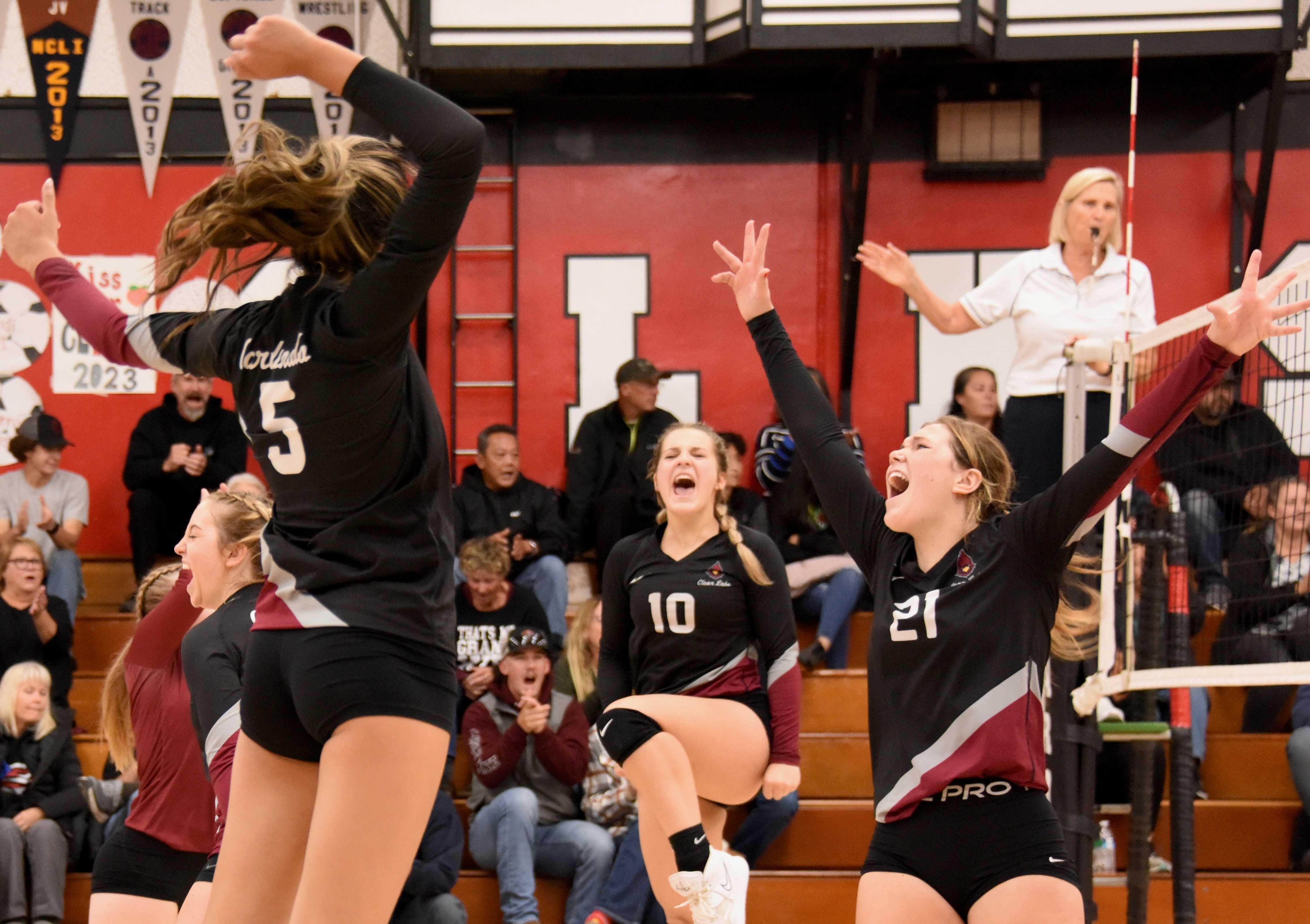 From left, Sierra Bruch, Rubi Ford, Quincy Paarsch and Abby Mertle celebrate after winning a hard-fought point against The Bay School. (Photos courtesy of Trett Bishop)