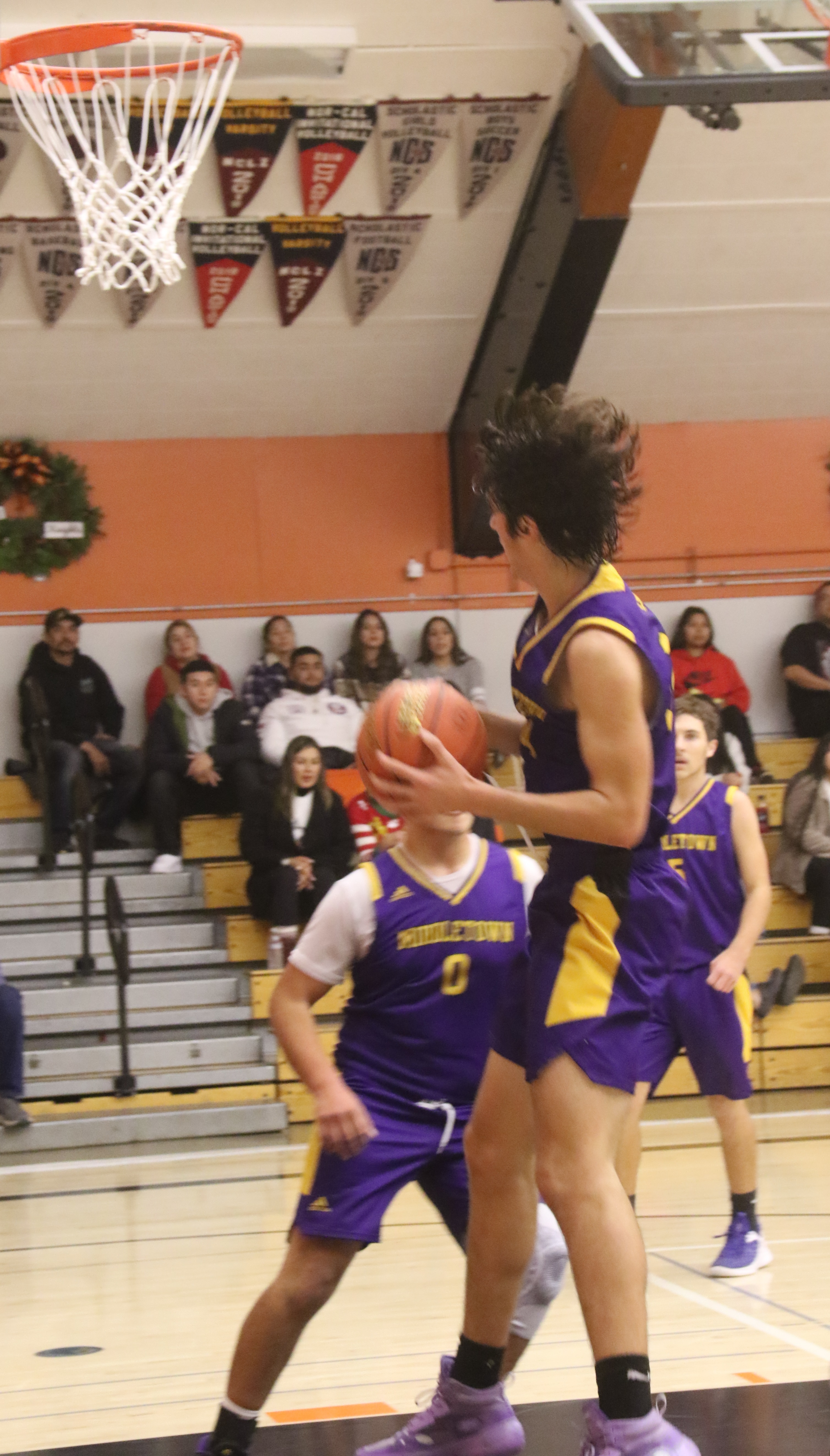 Middletown's Nadav Dicovski yanks down a rebound in front of teammate Oscar Cruz.